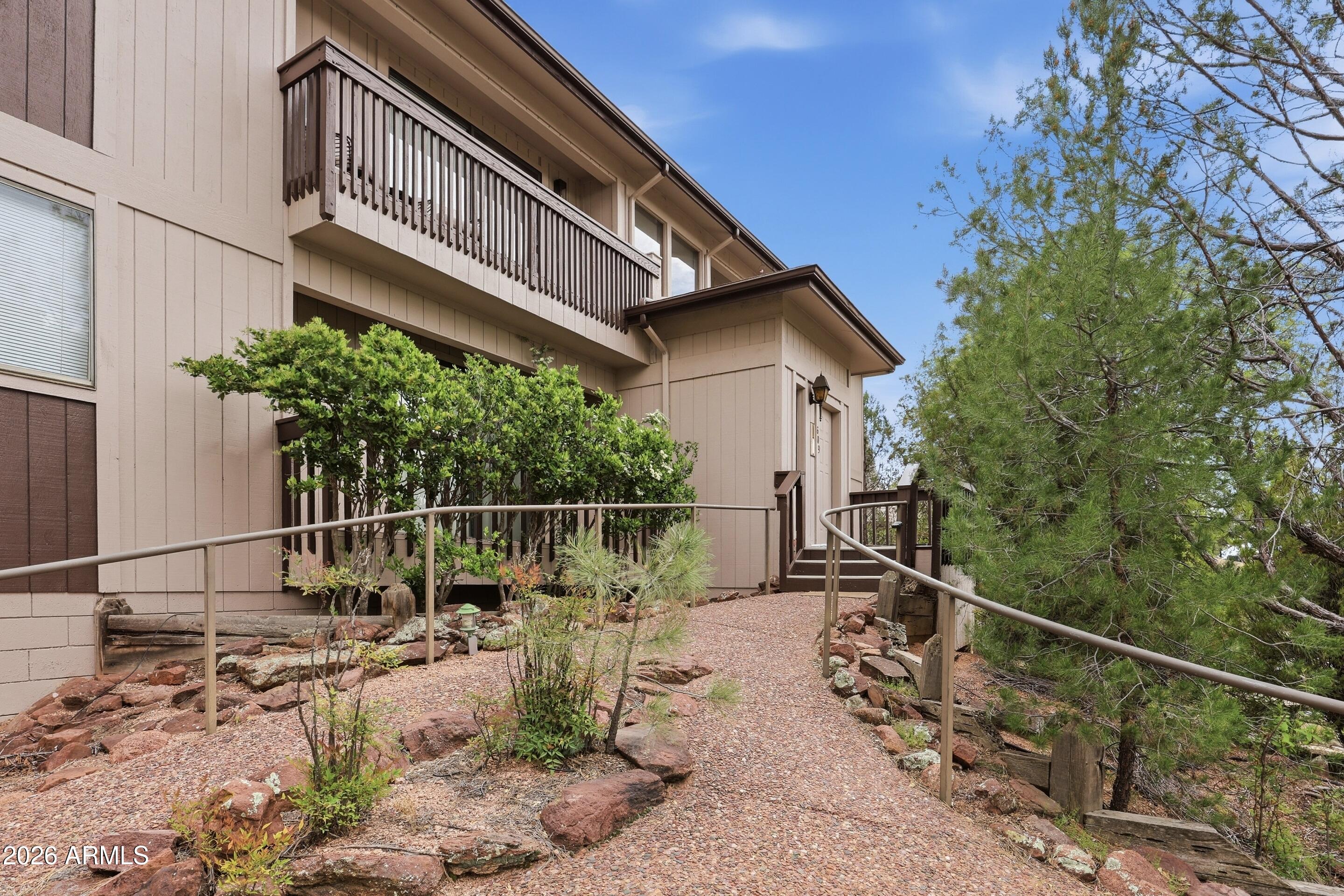 Fully renovated in 2023, this rare lower-level 2BR/2BA condo blends modern updates with cozy charm. Features include newer laminate flooring, fresh interior paint, upgraded bathroom vanities and fixtures, and newer kitchen countertops. Enjoy a real wood-burning fireplace for those cool Payson evenings and a picnic/BBQ area perfect for relaxing or entertaining. The standout feature is the 2-car garage with a bonus room and half bath--ideal for a game room, office, or guest space. Move-in ready and hard to find at this price point--don't miss it!