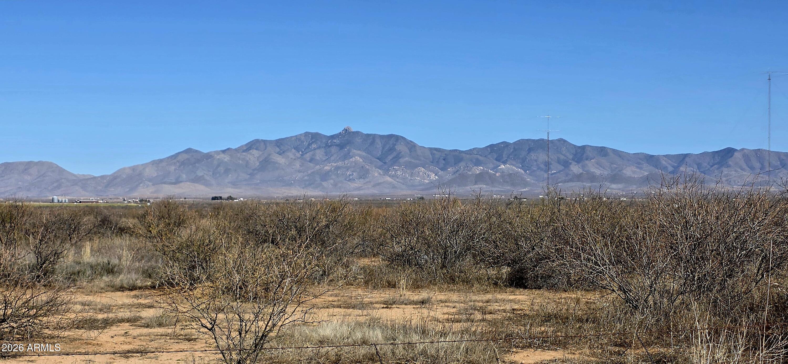This expansive 80-acre property is comprised of two 40-acre parcels, with power running along Chambers Road. Each parcel includes its own water well, with one well having been in operation as recently as a couple of years ago. The seller makes no guarantees regarding the condition of the wells, and buyers are encouraged to conduct their own inspections. The land is entirely level and ready for development. Located just two miles east of Kansas Settlement Road and two miles south of a proven grape-growing region, the property sits in Cochise County--an area gaining recognition for its boutique vineyards and wine industry. Willcox is only a short 15-20 minute drive, offering convenient access to services while still enjoying a quiet country lifestyle. Parcel Number 305-56-007 & 305-56-008