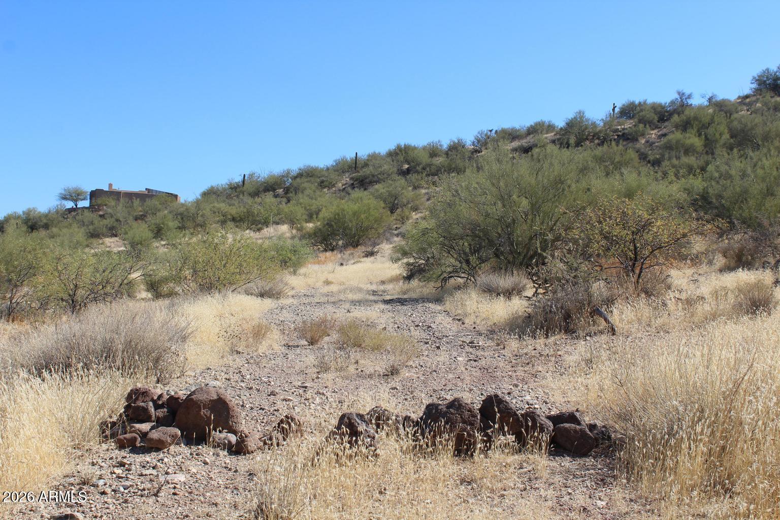 RARE FIND! 1.33 Acre CUSTOM HOME LOT! Experience the beauty and freedom that New River has to offer! Rare combination of privacy, open space, and natural scenery - this property is a true haven for outdoor enthusiasts and those seeking a peaceful desert lifestyle. NO HOA! Land is ready for development and includes ACCESS TO SHARED WELL. One-of-a-kind New River Location and Mountain Views! Welcome Home!