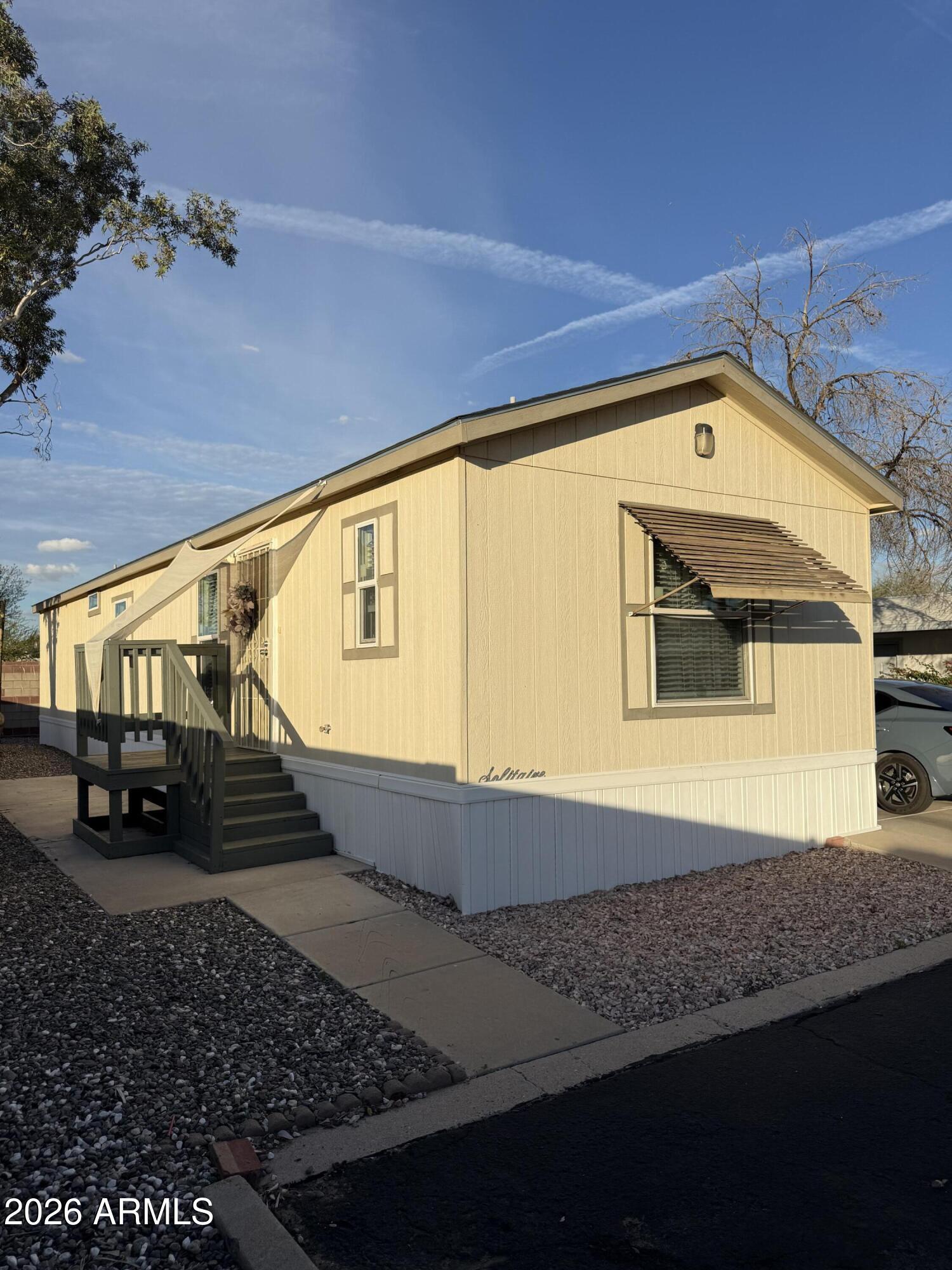 Well cared for manufactured home featuring a 2-bedroom and 2-bath on a desirable corner lot. This single owner home has been gently lived in and shows pride of ownership throughout. Refrigerator, washer and dryer are included, plus residents enjoy access to a clubhouse with great community amenities.