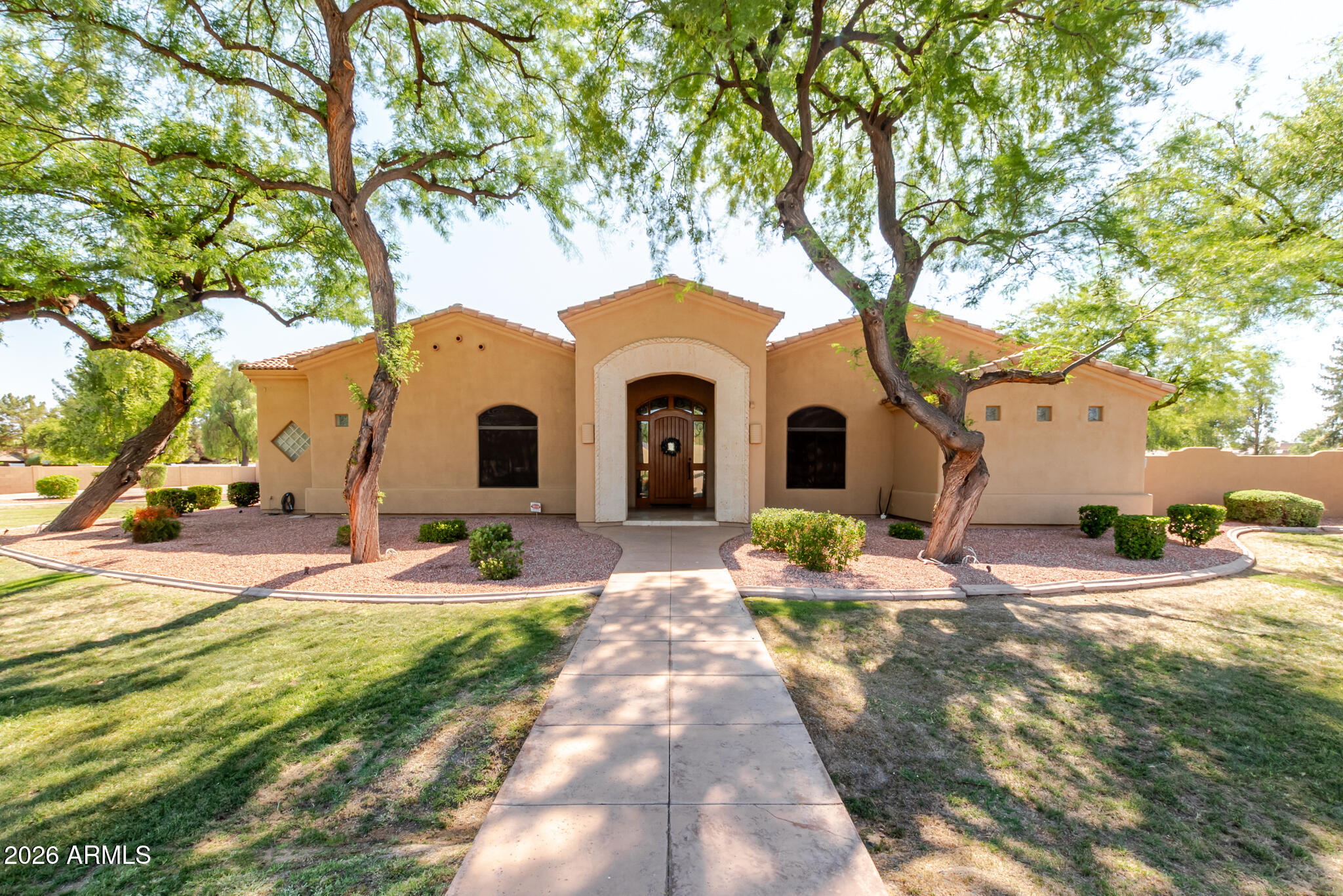 Beautiful custom home on over an acre of irrigated land!!
2 owners suites on each end of home along with 2 additional bedrooms, all with walk in closets - 3 full baths with separate jetted tub/shower plus 2 additional powder bathrooms, Also a separate office that can be an additional bedroom - Lots of room to entertain with large game room complete with full wet bar and huge outdoor patio with fireplace and newly renovated swimming pool/hot tub - Oversized 4 car garage with cabinets and work bench - additional covered RV + parking with 50 amp service.  Close to 101 / 202 - close to Chandler fashion mall - close to great restaurants and nightlife - come take a look!!