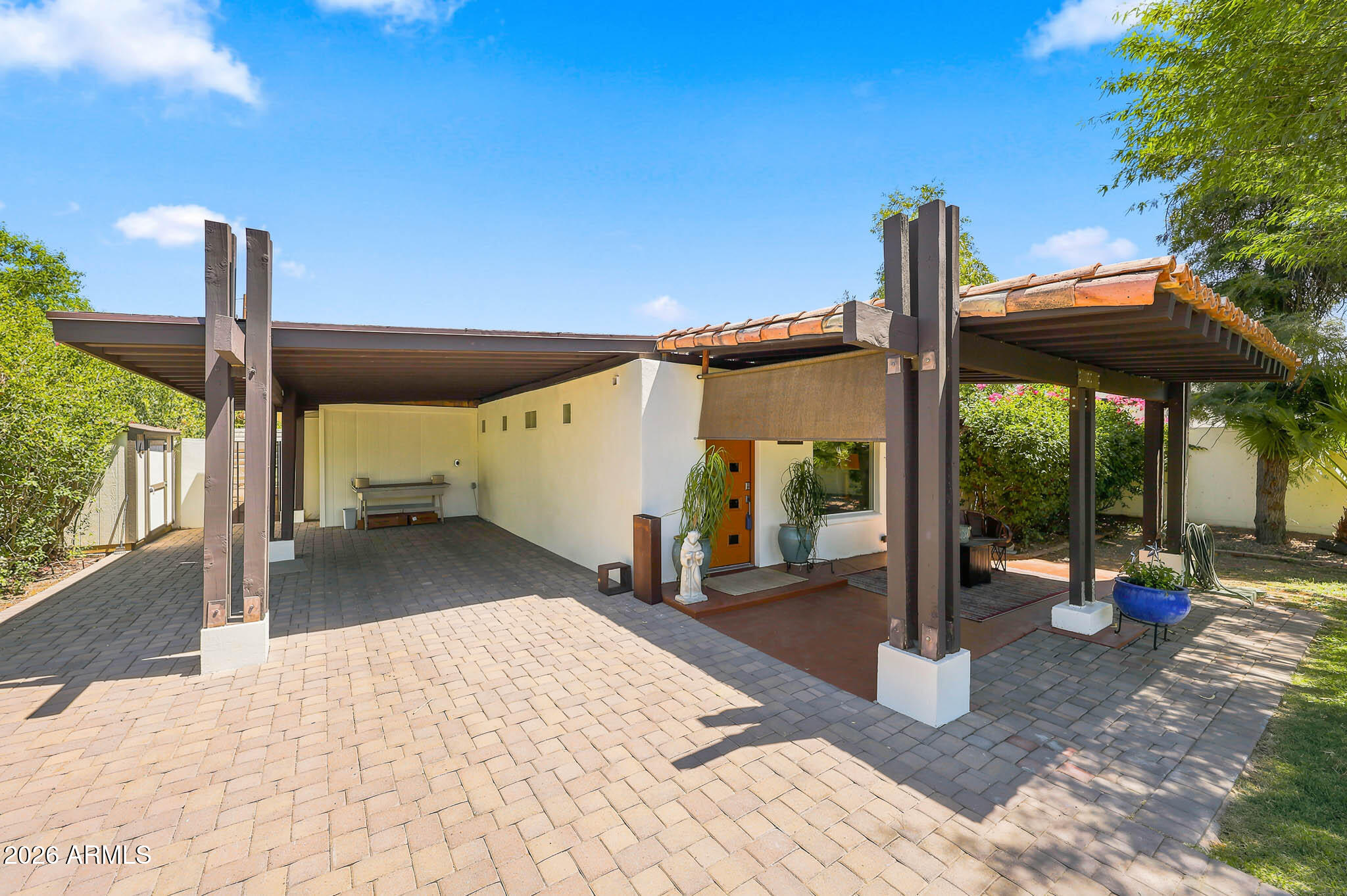 This beautiful adobe home was built in 1937 under the Subsistence Homestead Act during the Depression. The historica neighborhood jewel is tucked comfortably in a pocket of large irrigated trees which line the streets of the neighborhood. This preserved home underwent an expansion in the 1970's, and in 2009 bringing it to 1944 sq.ft. The main bedroom has a grand bathroom with a walk-in shower and large soaking tub. Two plus bedrooms include an office with a wall bed. Ceilings with gorgeous exposed beams, custom Mexican floors and thick, plastered walls create an atmosphere of vintage elegance, complemented by all modern conveniences. Electrical and plumbing have been updated for comfort and efficiency, Enjoy a lush yard with a She Shed and container for storage or a future ADU.