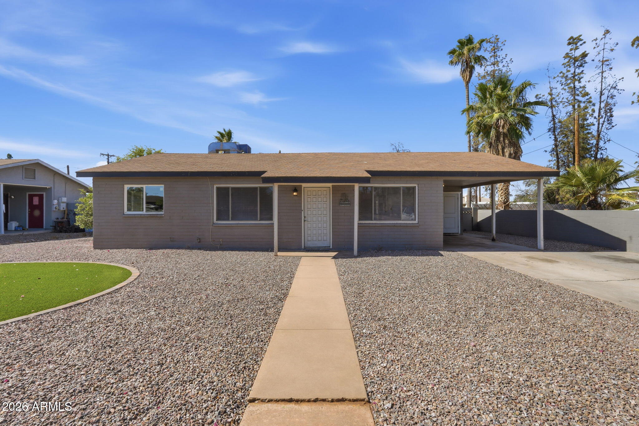 This home has plenty of room and potential for an owner with toys or equipment. The backyard is huge. Tile throughout makes this home easy to clean and maintain whether you'll reside here or use as an investment home. Theres a large room that could be used as an alternate living area, family room or bedroom that included a wood burning fireplace. 
Make this home yours! Seller is open to covering closing costs with preferred lender.