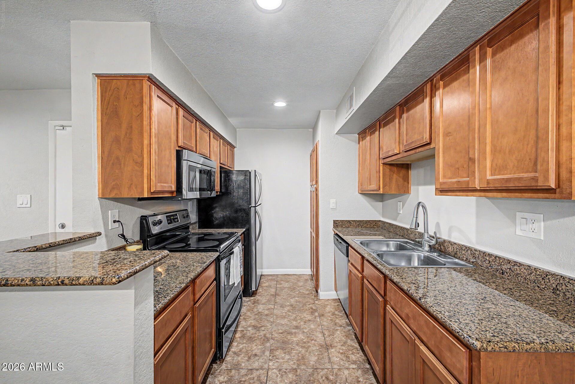 *No Stairs!* Live where Scottsdale convenience meets everyday enjoyment. This 1bed, 1bath Bella Vita condo offers 664sq.ft. of efficient living, in a prime Hayden & McDonald location. This is the best floorplan here making it feel much larger. Wood flooring spans the main areas, with new carpet in the bedroom (July 2026). The home features a comfortable living area, functional kitchen, stacked washer/dryer, walk-in closet, & covered patio with extra storage. Residents enjoy two saltwater pools, one heated, plus a spa, fitness center, clubhouse, and more. Enjoy direct access to the 11+ miles of the Scottsdale Greenbelt, bike ride trails, dog park, Chaparral Park, Old Town, restaurants, shopping, nightlife & outdoor recreation. A great opportunity for a low-maintenance Scottsdale lifestyle!