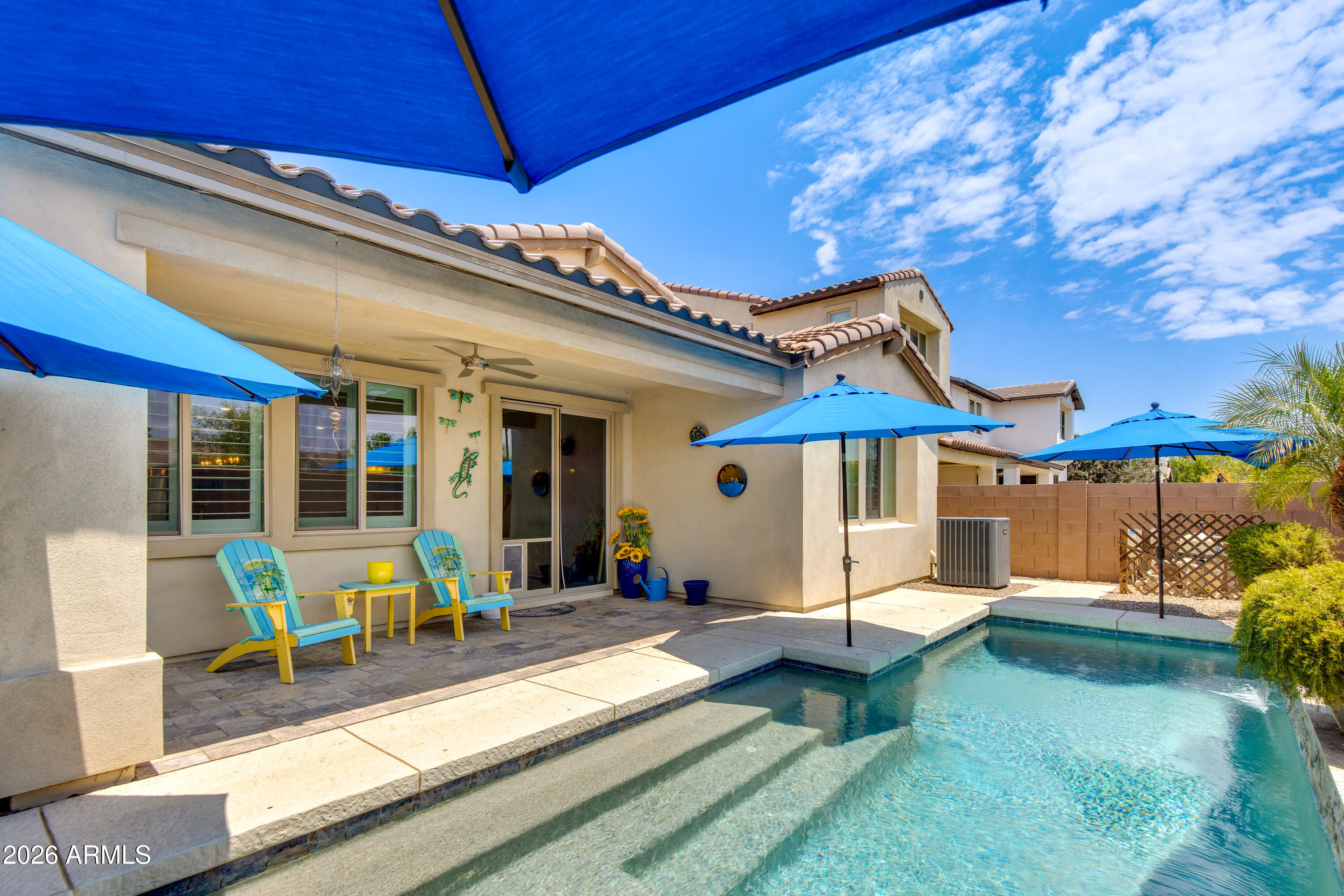 Your desert oasis awaits! Cool off in your sparkling pool, surrounded by lush landscaping, an expansive covered patio, & LED lighting system that sets the perfect mood in every season. Inside, enjoy this beautifully updated, move-in ready 3-bedroom, 2-bath home. Freshly painted and thoughtfully designed with an open-concept layout, the spacious great room flows effortlessly into the expansive kitchen, creating an inviting space for everyday living & entertaining. Tile flooring, elegant plantation shutters, & a desirable split floorplan add timeless appeal, while a versatile bonus room offers the flexibility of a home office, den, playroom, or fitness space. The spacious primary suite is a true retreat, featuring a beautifully renovated, spa-inspired walk-in shower designed for relaxation. This home is thoughtfully upgraded with timeless finishes and functional living spaces, and offers the perfect blend of comfort, style, and convenience. Ideally located near shopping, dining, parks, recreation, and major freeway access, this home is ready for you to move in and enjoy everything Arizona living has to offer.