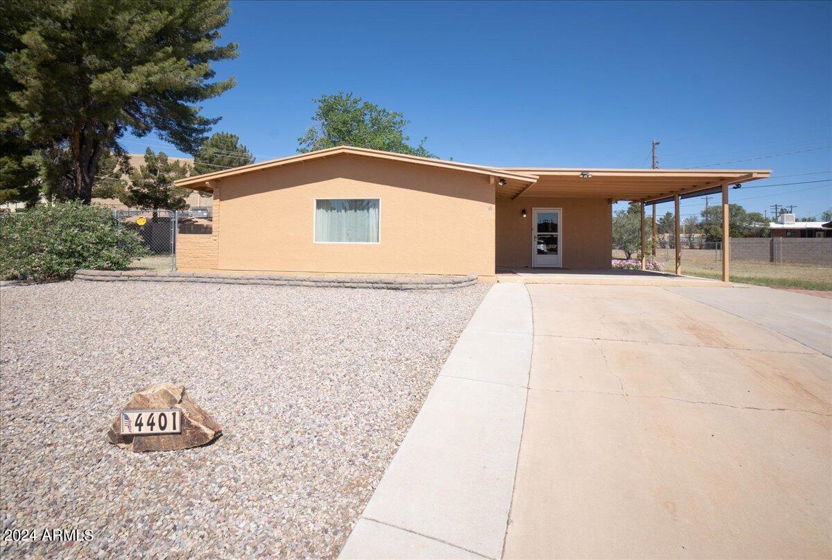Move in ready BEAUTIFULLY updated home, inviting  kitchen with modern features great for entertaining that connects seamlessly to the dining area. Wood-look ceramic tile throughout kitchen, dining & traffic areas. Spacious laundry/utility room and an added bonus room which could make a terrific office or extra bedroom with it's own door to the outside. The primary bedroom has lots of light from it's own sliding glass door to the large backyard. Yard is generous in space with several areas which may be used for outdoor living. Front covered patio with plenty of room to relax and two parking areas on either side. New roof in 2021. Located in a cul-de-sac on a nice size lot.