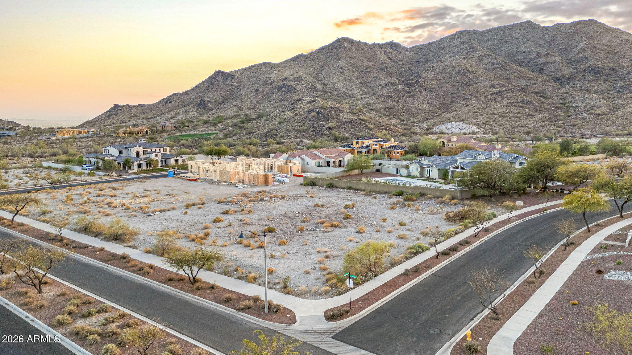 This exceptional corner lot in the highly sought-after Verrado community is now available! Offering breathtaking views and a prime location, this spacious lot is the perfect canvas for your dream home. Nestled in a master-planned community, Verrado boasts an array of top-tier amenities, including a championship golf course, two community pools, a state-of-the-art fitness center, and more. Enjoy a vibrant lifestyle with a variety of restaurants, boutique shopping on Main Street, and miles of scenic hiking and biking trails. Plus, with year-round community events and activities, there's always something to enjoy. Conveniently close to shopping and entertainment, this lot offers the best of both worlds--peaceful desert beauty with modern conveniences just moments away.