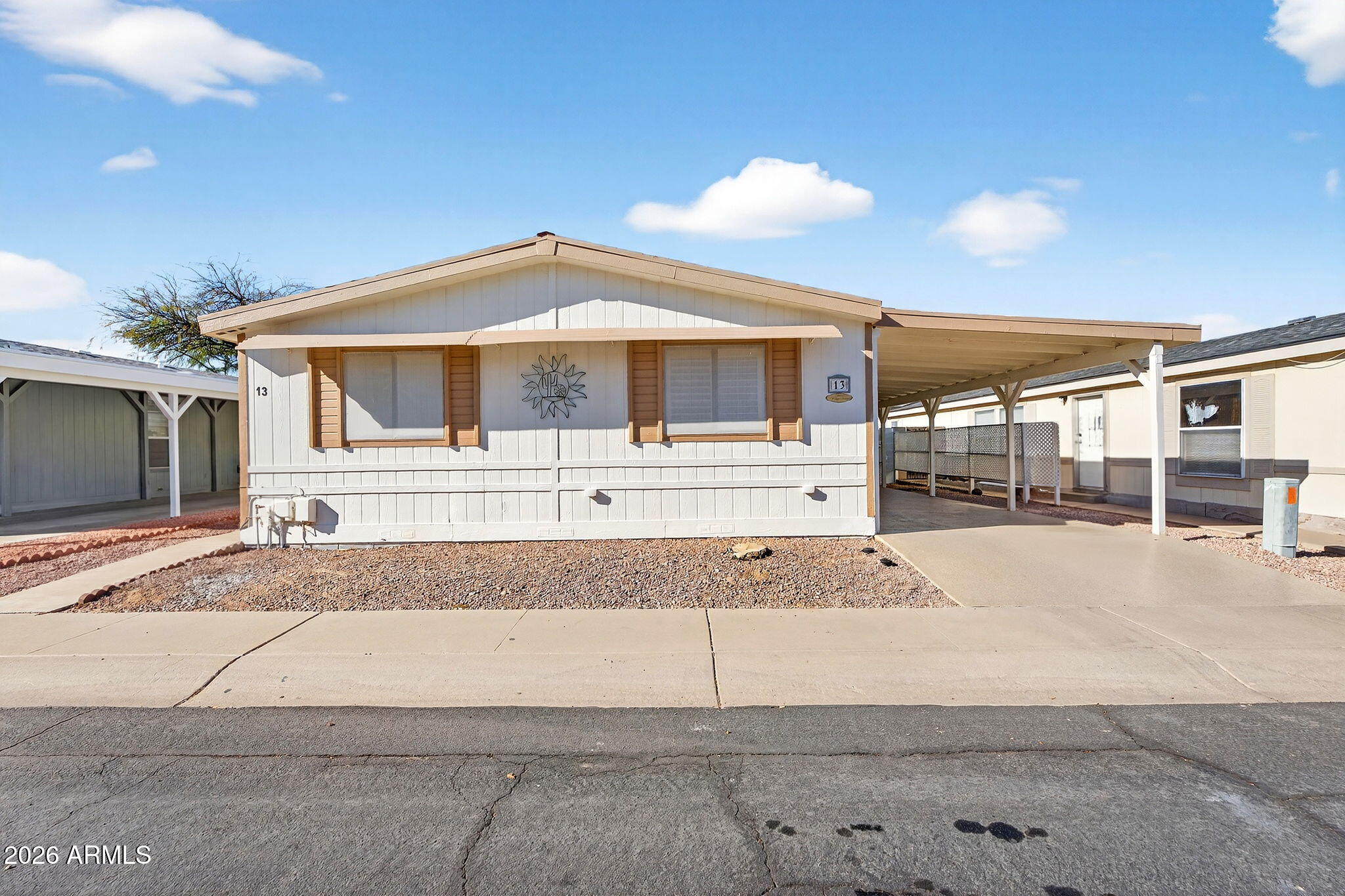 Completely remodeled manufactured home in Peoria located in a rare all-ages community with owned land and rentals allowed--a great opportunity for both homeowners and investors. This move-in ready home features fresh interior paint, updated finishes, and a brand new A/C system, providing comfort and efficiency for Arizona living. Enjoy covered parking, low-maintenance desert landscaping, and a convenient location near shopping, dining, and freeway access. Unlike many manufactured home communities, this property includes fee-simple owned land (no land lease). Perfect as a primary residence, winter home, or Peoria investment property with rental potential.