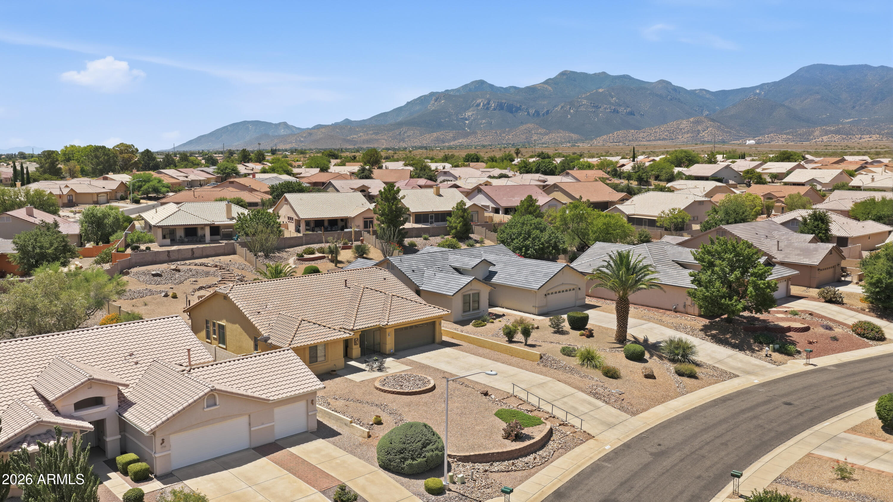 Another wonderful property on one of the ''Private'' Roads in Winterhaven!!!  This property has a lovely setting on a larger, but very low maintenance lot...the driveway plateaus to ''FLAT'' for easy vehicle access and lots of parking up there too!!!  Amazing Elevations in front and back for quality 4th of July Fireworks and amazing Huachuca Mountain Views!!!  The home is a 3/2/2 with a welcoming Front Room/Great Room, Larger Kitchen with Eat-In Area and Island, and Separate Dining Area!!!  Cozy  AZ Room leads out by way of your Tri-Lock French Doors to your Huge Patio with Fountain and very low maintenance Backyard ...Nice-size Master Bedroom Suite and Bath...Guest Suite is also ample-sized and private too!!!  Lot is 1/3 Acre...Home is 2022SF,,,very comfortable inside and out!!!