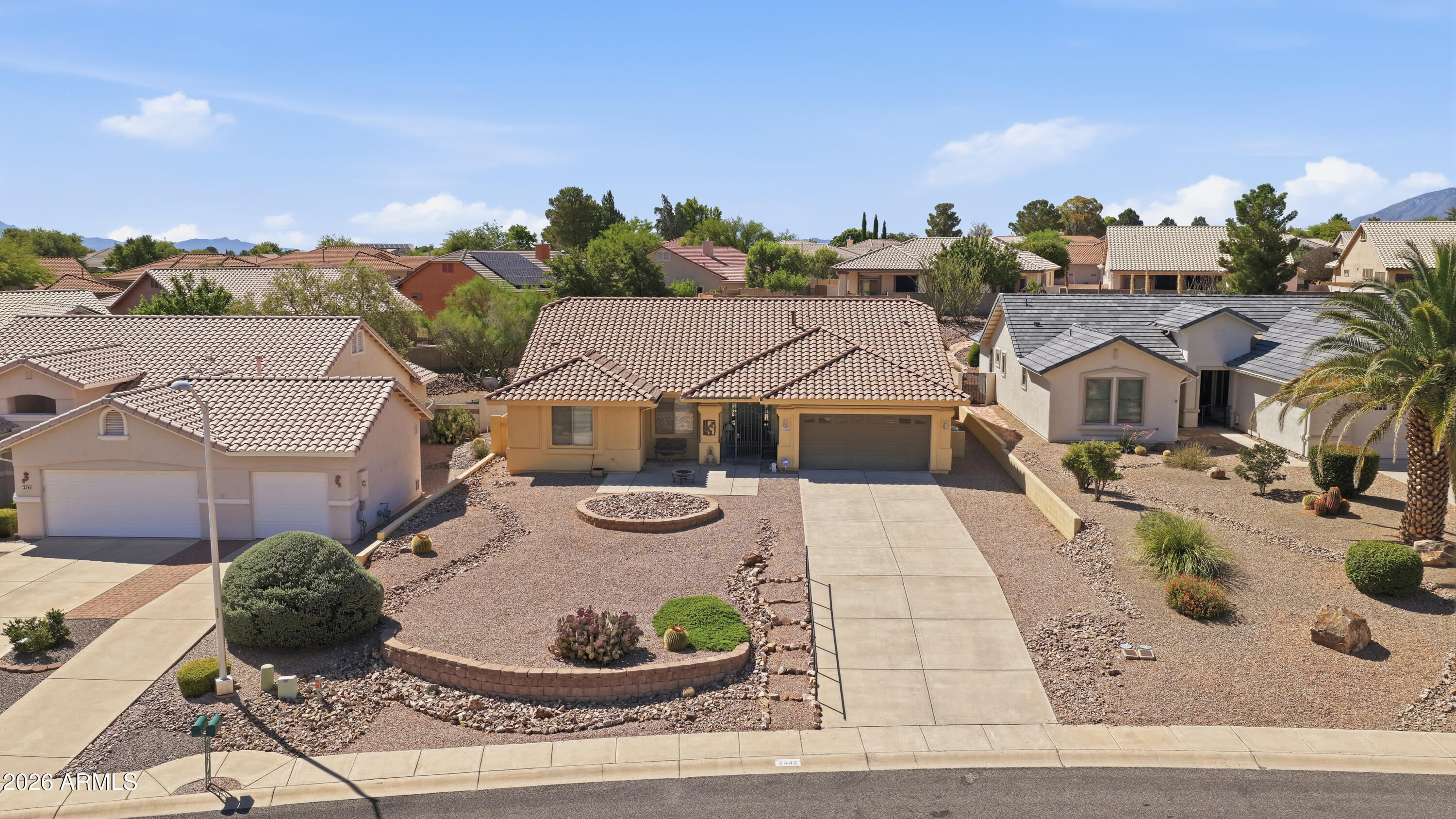 Another wonderful property on one of the ''Private'' Roads in Winterhaven!!!  This property has a lovely setting on a larger, but very low maintenance lot...the driveway plateaus to ''FLAT'' for easy vehicle access and lots of parking up there too!!!  Amazing Elevations in front and back for quality 4th of July Fireworks and amazing Huachuca Mountain Views!!!  The home is a 3/2/2 with a welcoming Front Room/Great Room, Larger Kitchen with Eat-In Area and Island, and Separate Dining Area!!!  Cozy  AZ Room leads out by way of your Tri-Lock French Doors to your Huge Patio with Fountain and very low maintenance Backyard ...Nice-size Master Bedroom Suite and Bath...Guest Suite is also ample-sized and private too!!!  Lot is 1/3 Acre...Home is 2022SF,,,very comfortable inside and out!!!