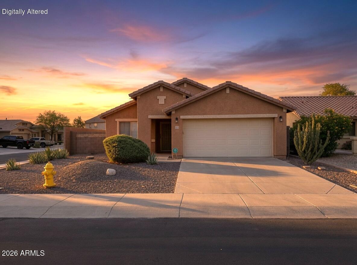 Impeccably maintained and in truly exceptional condition, this move-in-ready 3-bedroom, 2-bathroom home in Buckeye's desirable Tartesso community stands out as one of the best available options in the West Valley. This FULLY FURNISHED gem of a home offers a corner lot with north/south exposure. Features include a split floor plan, granite counters, Gas range, matching Whirlpool stainless appliances, plantation shutters throughout, deep freezer, large covered patio, pavered backyard, 2-car garage, and low-maintenance desert landscaping with irrigation. Conveniently close to a pocket park with play gournd and splash pad. Recent updates include new HVAC in 2024, new water heater in 2021. Tartesso delivers an outstanding lifestyle with its expansive sports park featuring tennis courts, volleyball, basketball, soccer & baseball fields, plus playgrounds, walking/biking paths, greenbelts, and splash pads, all set against the beautiful White Tank Mountains.