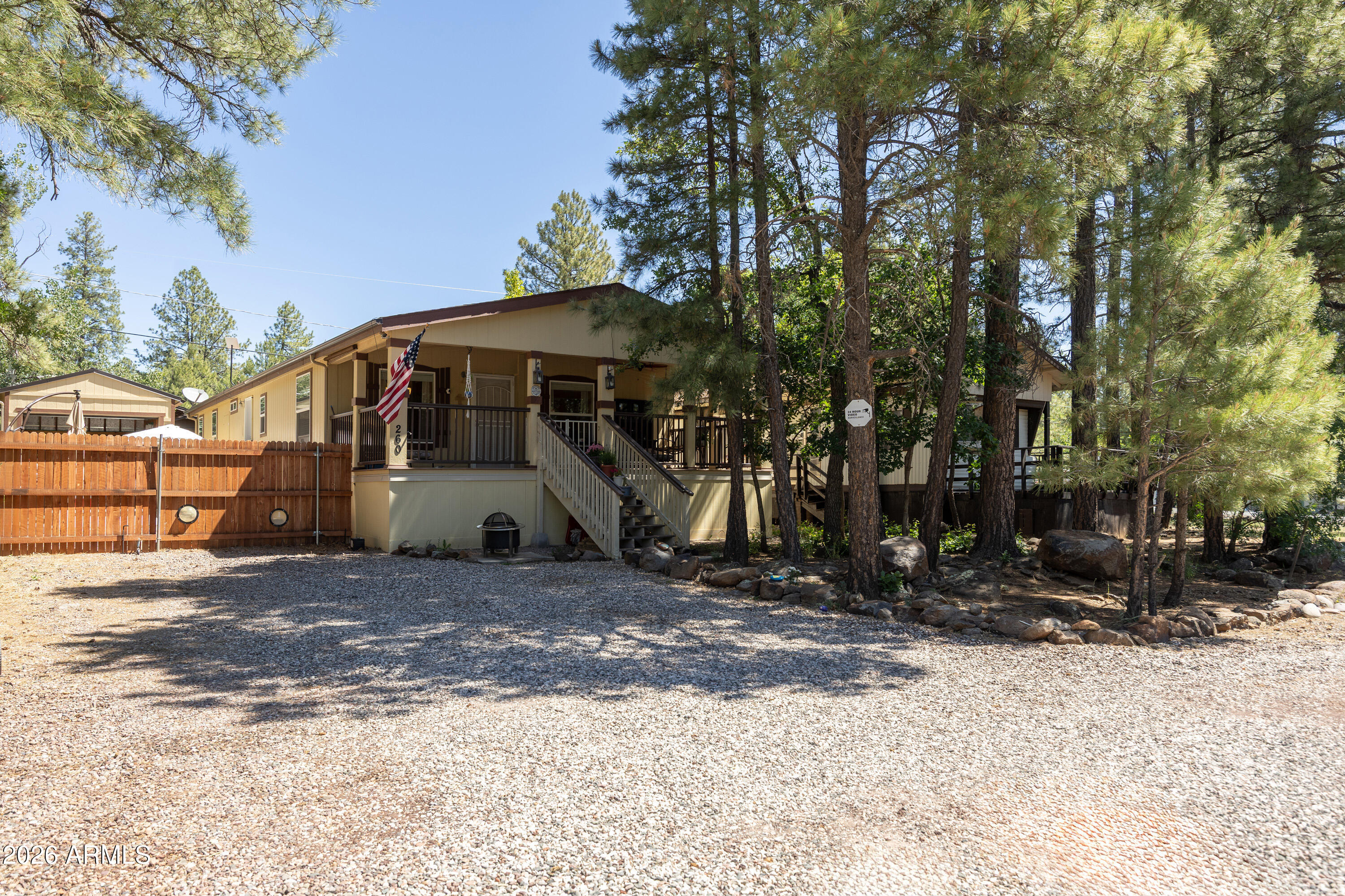 SHORT SALE OPPORTUNITY. Sale subject to lender approval. 3 bedroom, 2 bathroom, Cavco double wide manufactured home with fenced yard and GARAGE. Cute and cozy property with tongue and groove walls, vinyl plank floors, upgraded cabinets, stainless appliances, ceiling fans and electric furnace. Fireplace can function with propane gas or real wood. Home includes propane powered Generac Generator for stress-free, year-round living.