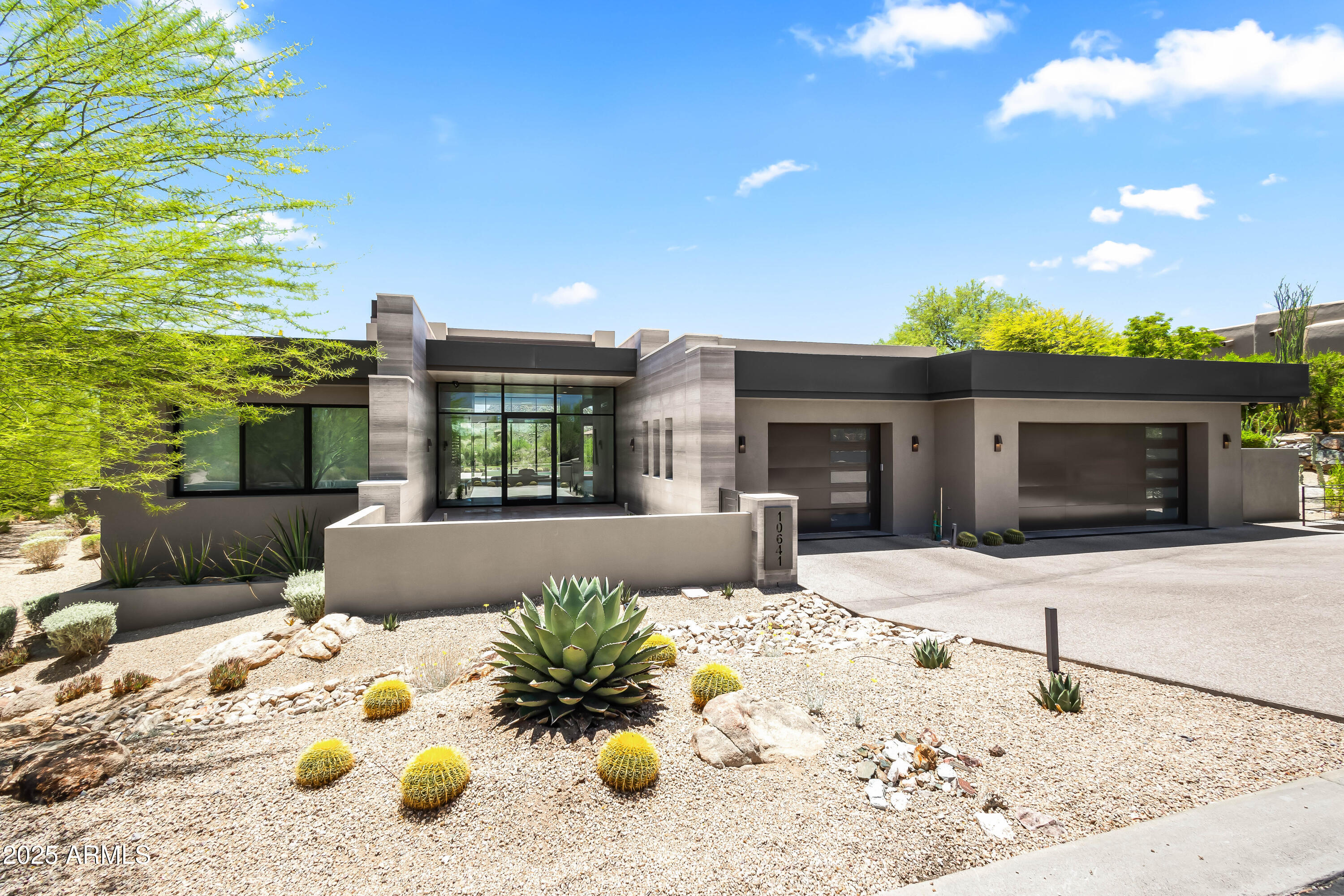 Welcome to your private retreat in the prestigious gated community of Candlewood Estates at Troon North. This stunning custom home offers breathtaking south-facing views of Pinnacle Peak and the Sonoran Desert. Soaring ceilings, expansive windows, and a seamless indoor-outdoor flow highlight the open-concept layout and split floor plan. The chef's kitchen features high-end stainless appliances, custom cabinetry, walk-in pantry, and a spacious island that opens to the family room with a fireplace and wet bar. The primary suite boasting a spa-like bath, soaking tub, oversized shower, walk-in custom closet, and private entry to the backyard. Three add'l en-suite bedrooms offer ample space for guests or a home office. Step outside to enjoy Arizona's resort-style living with a sparkling pool and spa, built-in BBQ, firepit, and multiple covered patiosperfect for entertaining family and friends. Located minutes from world-class golf at Troon North, hiking trails, and upscale dining and shopping, this is desert living at its finest. Don't miss the opportunity to own this exceptional property in one of Scottsdale's most sought-after communities.