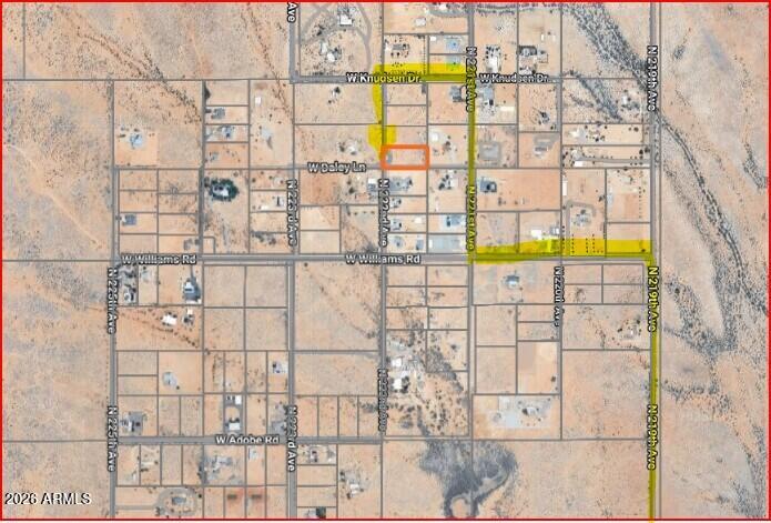 Don't miss the opportunity to own this 1.19 acre of flat land in Surprise, AZ. Perfect for your dream home with utilities available- just tap in!  Your dreams are attainable as seller financing is available with 20% down.  No HOA and no flood plain. Build what you want when you want. This prime piece of land is perfectly poised for building your dream home surrounded by scenic views, custom homes and a peaceful rural setting. South boundary already has a block wall saving your tons of money! Survey and soils test is also provided, saving even more in your pocket!  Progress is heading this way but this rural pocket of custom home lots is right in the middle of it!  Come see today.