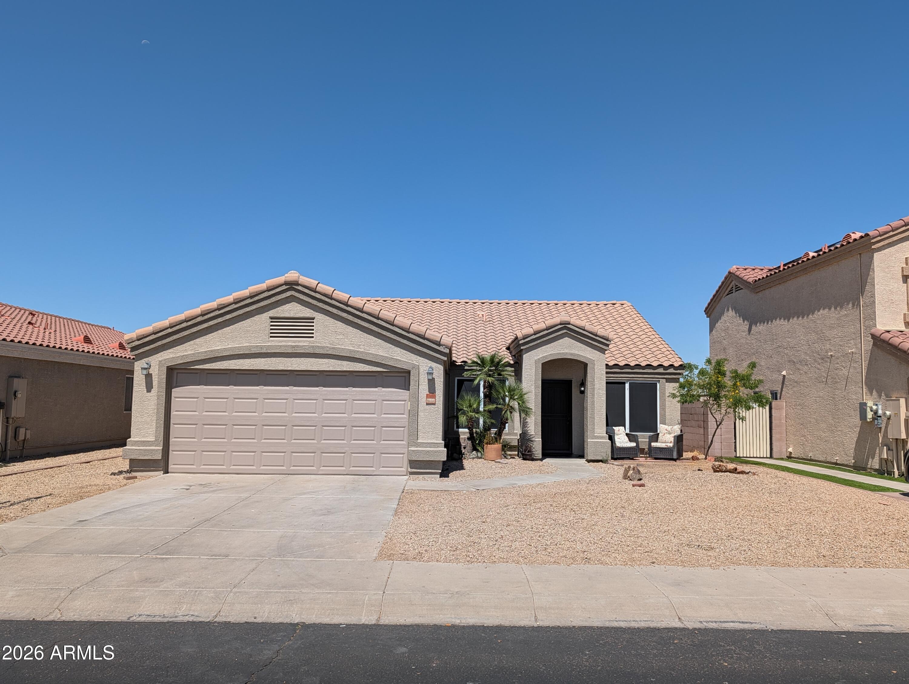 Welcome to this expansive 4 bedroom, 2-bathroom home in the desirable Canyon Ridge West community! The covered entry invites you into this home. Some of the updated features include New AC in 2023, Solar Window shades, New Hot Water Heater, New Garage Door and opener. Large windows & vaulted ceilings. Enjoy cooking in this kitchen with warm-toned cabinetry, granite countertops, and an island opening to the breakfast area and secondary living room. Relax in your primary suite, complete with a walk-in closet and bathroom with double sinks. Head outside to grill out on the patio and soak up the beautiful sunsets that you will enjoy in this backyard. This home is minutes to restaurants, parks, schools, and more! Wonderful home across from a park in a gated community.