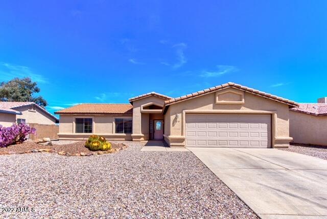 Beautiful 3 bedroom, 2 bathroom home with a 2.5 car garage in desirable Canyon De Flores. Great Mountain Views from front and back. Features tile throughout except for bedrooms, gas fireplace in the living area, stainless steel appliances, extended epoxy covered patio, jetted tub in the master bath with a separate shower, and large yard with plenty of room to add a pool! Even better? This home sits on a premium lot that backs to Garden Canyon Park/Trail with no neighbors directly behind! Your view from your bay window in the master bedroom, living room, dining room, and back porch are all of the gorgeous Arizona skies! Come see this great home  before it's gone!