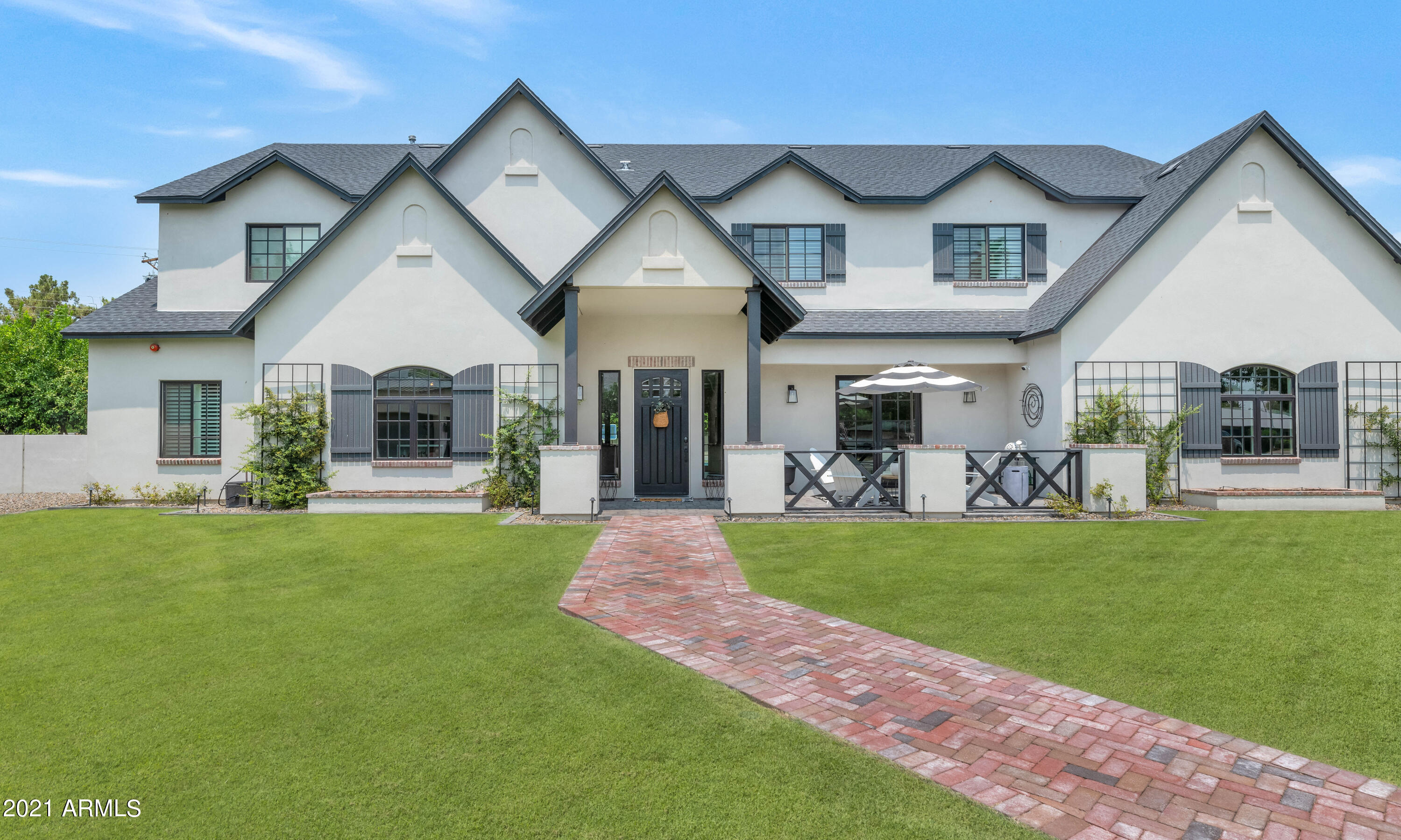 This beautiful home is the epitome of what we've come to expect from Arcadia's unique cottage style living. The gorgeous island kitchen has plenty of space for prep and entertaining with Viking and Subzero appliances, custom cabinetry and a large farm house sink. The great room makes a bold statement with a floor to ceiling fireplace, intricate ceiling design, custom millwork, and a wall of french doors leading to the freshly renovated backyard. All of the ensuite bedrooms are outstanding, including an impressive master hideaway, each bathroom has its own unique design twist, and the large office/library is another very special space. Quality finishes enhance the character of the home, including pristine wide plank wood flooring, furniture grade cabinetry, sleek marble and honed surfaces, artistic tile accents and unique lighting, and the open floor plan, impeccable design elements and private cul de sac lot with incredible mountain views combine to create a fantastic environment perfect for family living!