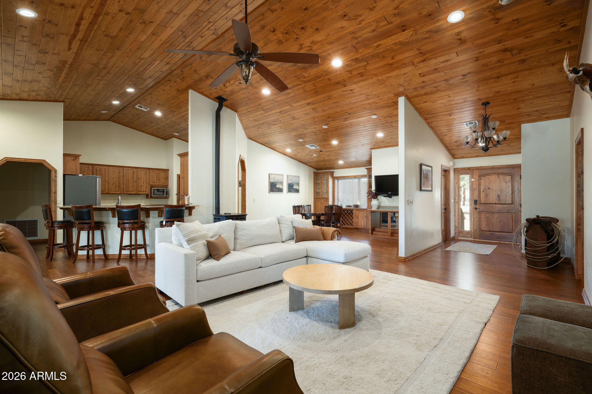 *Owner/Agent* Escape to your own private Northern Arizona ranch on nearly 12 acres backing directly to National Forest land. With no HOA, direct trail access, and endless room to roam, Fox Ranch offers a rare combination of privacy, recreation, and comfort just minutes from Munds Park.

Built in 2017, this thoughtfully designed home features 3 bedrooms, 2.5 bathrooms, and 2,416 square feet of living space highlighted by newly installed maple hardwood flooring, vaulted ceilings, abundant natural light, and stunning views of the surrounding pines and meadows. The spacious primary suite includes a versatile bonus room perfect for a home office, nursery, workout space, or additional sleeping area for kids and guests.

Designed with horse lovers in mind, the fully fenced property includes a cinder riding arena, round pen, multiple horse shelters, and several livestock and horse enclosures. Step out your back gate and enjoy miles of riding, hiking, and exploring through the National Forest, complete with natural spring-fed water sources throughout the trail system.

The property is serviced by a shared well with only four neighboring properties and is equipped with a Briggs & Stratton whole-home backup generator, providing peace of mind and year-round reliability. Whether you're seeking a full-time residence, mountain retreat, family ranch, or equestrian getaway, this property is built to support the lifestyle.

Available furnished with an acceptable offer, Fox Ranch presents a turnkey opportunity to enjoy the very best of mountain living. Rarely do properties offer this level of acreage, direct National Forest access, equestrian infrastructure, modern construction, and freedom from HOA restrictions - all in one exceptional package.

Hide