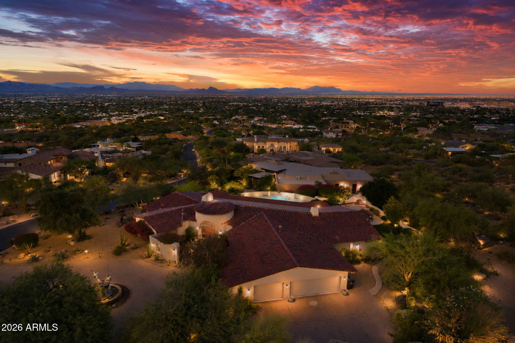 Perched on one of Camelback Mountain's most coveted acre-plus homesites, this exceptional Paradise Valley estate offers breathtaking panoramic views across the Valley, sparkling city lights, vibrant sunrises, and iconic mountain vistas. Set on prestigious Sage Drive, the property combines privacy, elevation, and natural beauty in one of Arizona's most sought-after locations. Thoughtfully positioned to maximize its extraordinary setting and connection to the surrounding desert landscape, the residence offers endless possibilities to enjoy as-is, renovate, or reimagine as a custom estate. Surrounded by the beauty of Camelback Mountain yet moments from world-class dining, luxury shopping, golf, and resorts, this is a premier Camelback Mountain homesite in the heart of Paradise Valley.