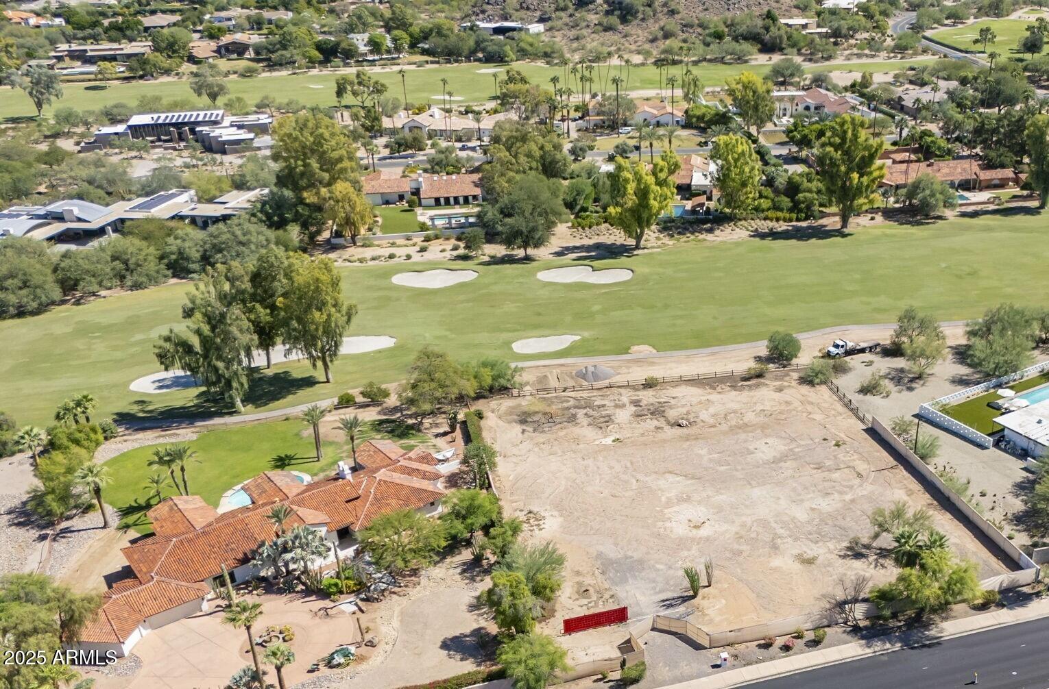 Framed by the iconic Mummy Mountain, Camelback Mountain, and the Phoenix Mountain Preserve, this exceptional property captures some of the most breathtaking views in all of Arizona.
A private front gate ready for a block wall offers elevated privacy, security, and sound mitigation, creating a quiet retreat just moments from it all. The yard backs to the 6th fairway at the exclusive Paradise Valley Country Club, providing a peaceful and elegant backdrop.
From sunrise to sunset, enjoy sweeping mountain views that embody the natural beauty of Paradise Valley living.
Situated on a generous 1.09-acre lot, this property offers ample space to design and build your dream home, with unlimited potential to craft a custom desert sanctuary.
A rare opportunity in one of Arizona's most prestigious and sought-after locations, ready for a new owner to bring their vision to life.