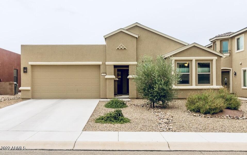 Stunning home ALERT! 4 bedroom, 2.5 bathroom, over 2000+ sq. ft.!!! If you need that extra space and crave all those extra high end features this one is for you! You enter through a beautiful, private courtyard. Welcome to open concept living! Wood look tile throughout the home. No carpet here! Upgraded 42'' slate maple cabinets, quartz countertops, pot drawers, stainless steel appliances, subway tile backsplash, breakfast bar, kitchen island. Eat in kitchen area & a formal dining room area! Keep it casual or get fancy! Fireplace in living room. Large owner's suite with exterior access to backyard, double sinks, executive height countertops, custom walk in closet. Backyard has covered and uncovered patio with uplighting for great ambiance!