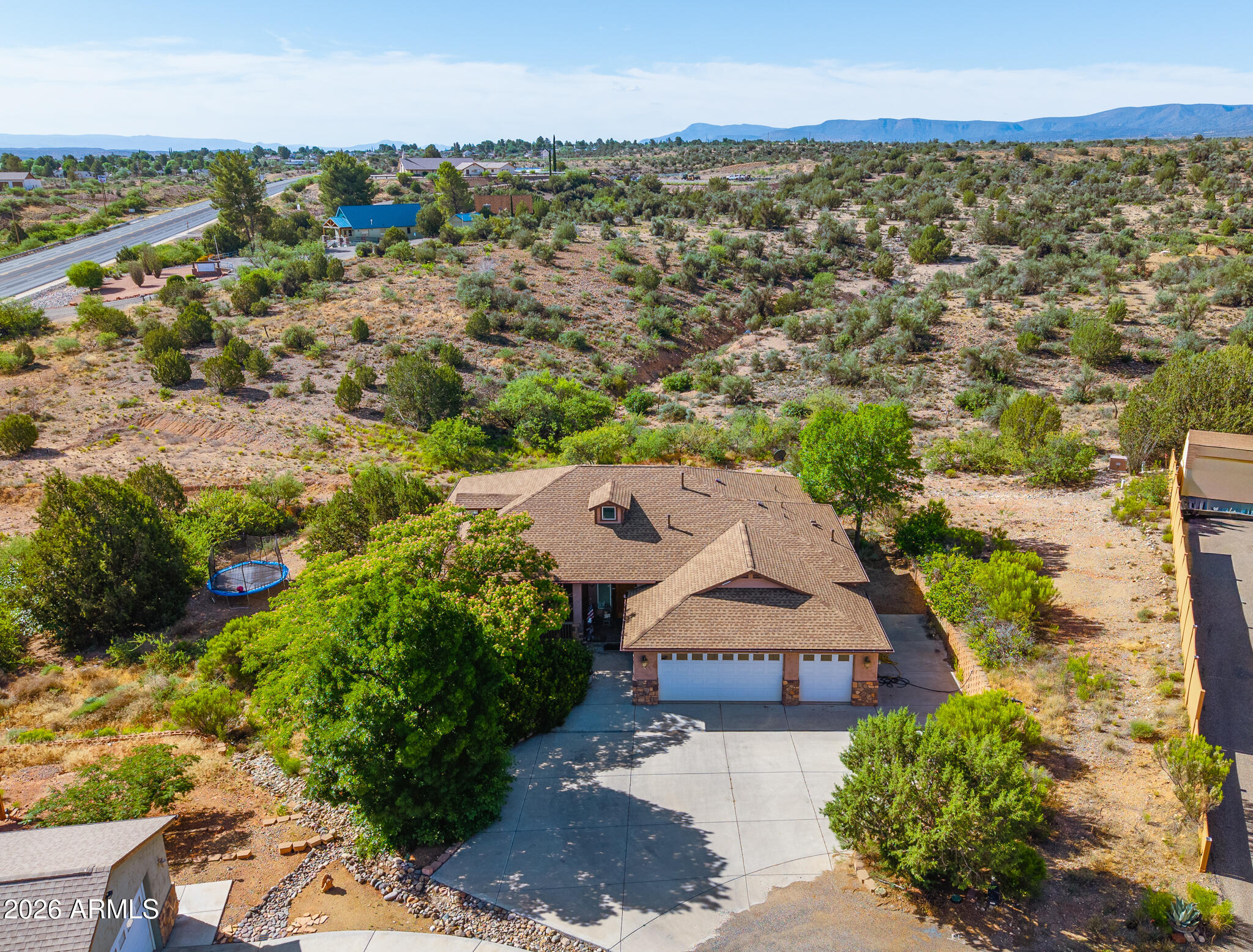 Red Rock & Mingus Mountain Views | 4BR/3BA | 3,690 SF | New Roof 2025 | New Main-Level AC | No HOA | Cul-De-Sac | Cottonwood AZ

Red Rock and Mingus Mountain views set the stage for this exceptional Cottonwood, AZ single-family home -- a rare 3,690 sq ft, 4-bedroom, 3-bathroom retreat tucked at the end of a cul-de-sac on just under an 1-acre & NO HOA. Backs to State Trust Land, this Verde Valley home delivers unobstructed views from nearly every vantage point.

Major upgrades are already done for you: a brand-new roof (September 2025) and a brand-new main-level A/C unit provide peace of mind and years of worry-free ownership -- two of the biggest-ticket items checked off. The open-concept main level is designed for easy living, featuring a large kitchen with breakfast bar and pantry, a generous living room bathed in natural light, a convenient powder room, and a sprawling primary suite complete with double vanity and separate shower and soaking tub. The primary suite and all main-level living spaces are served by the new AC unit, keeping comfort front and center all Arizona summer long.

Parking is never a concern -- the oversized 3-car garage plus RV access/parking accommodates every toy and vehicle. A covered patio and balcony extend your living space outdoors, perfectly framed by natural desert-scape landscaping front and back. Served by a private well and city water with a septic system.

No HOA. No fees. Just views, turnkey upgrades, and Verde Valley living.