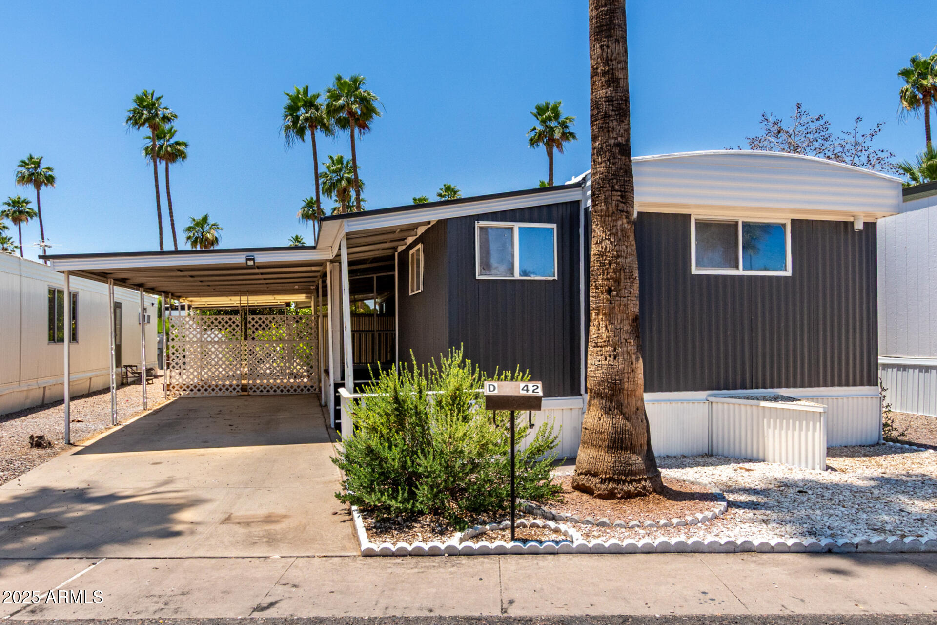 Welcome to this single-level residence in Phoenix! The recently renovated interior features fresh paint, ceiling fans, wood-look flooring, dual pane windows, and abundant natural light. You'll LOVE the perfectly flowing open floor plan, ideal for entertaining guests. The renewed kitchen comes with white cabinets, solid surface counters, a range hood, and an electric range. Have a good rest in the sizable primary bedroom, offering a walk-in closet and a private bathroom with dual sinks. The secondary bedroom includes a well-sized closet for added comfort. Outside, you will have a covered patio where you can unwind after a busy day. This turn-key abode is waiting for you!