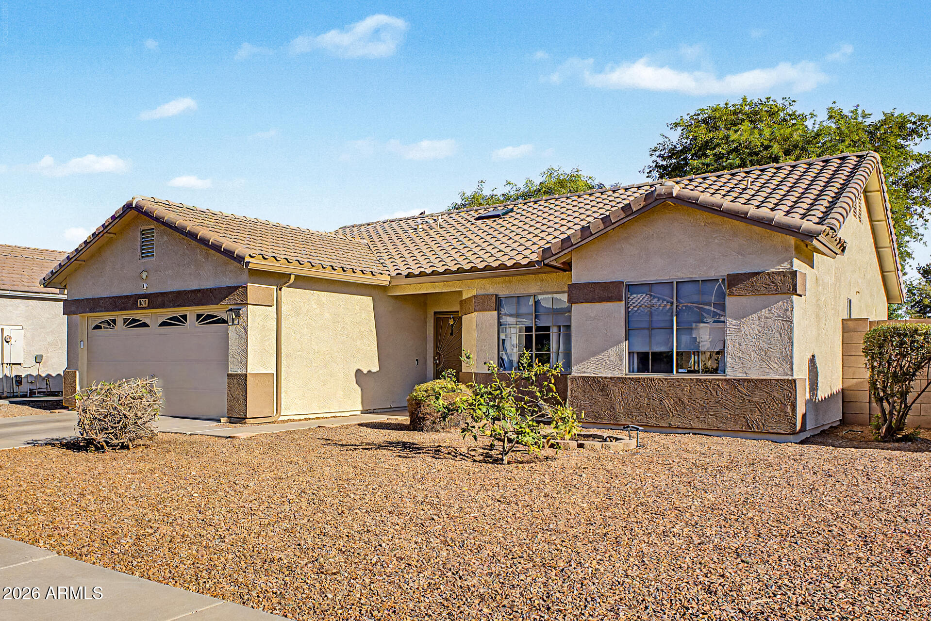 This very well kept 3 bedroom, 2 bathroom home with a 2 car garage is ready for its next owner. Freshly painted exterior gives it sharp curb appeal from the moment you pull up.

Inside there is ceramic tile that runs through the main living areas: entry, family room, kitchen, hallways, and both baths, keeping things clean and easy to maintain. The kitchen features plenty of cabinet space and a walk in pantry. A dedicated laundry room with extra storage adds everyday convenience.

The primary suite offers a walk in closet and an en suite bath with a double sink vanity and combo tub and shower, plus built in shelving for linens.

HVAC was replaced within the last year. Out back features a covered patio that  overlooks a beautiful grassy yard with mature shade trees, perfect for relaxin or entertaining.

A solid home with the upgrades already done