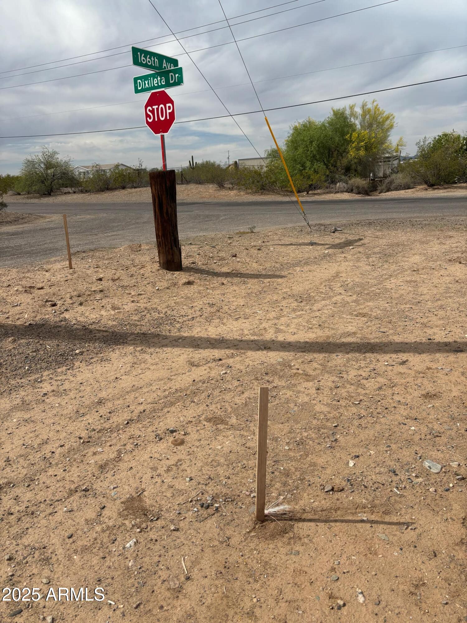 All paved roads, no flood zone, and no HOA! This incredible parcel has water and electric available on property and high-output WiFi  (Phoenix Internet 64 gig) tower nearby for fast connectivity. The property has already been surveyed, marked, and staked! Bring your horses, toys, and the whole family to enjoy space and freedom with a rural feel while still being minutes from city conveniences. Located just off 163rd & Dixileta, you'll have easy access to the new Fry's Marketplace and shopping center coming to 163rd & Route 60. Fire department, church, and hospital are all nearby. Horse training facilities and corrals are just across 166th. Private water company. Opportunities like this don't come around often—secure your slice of Arizona now before it's gone.