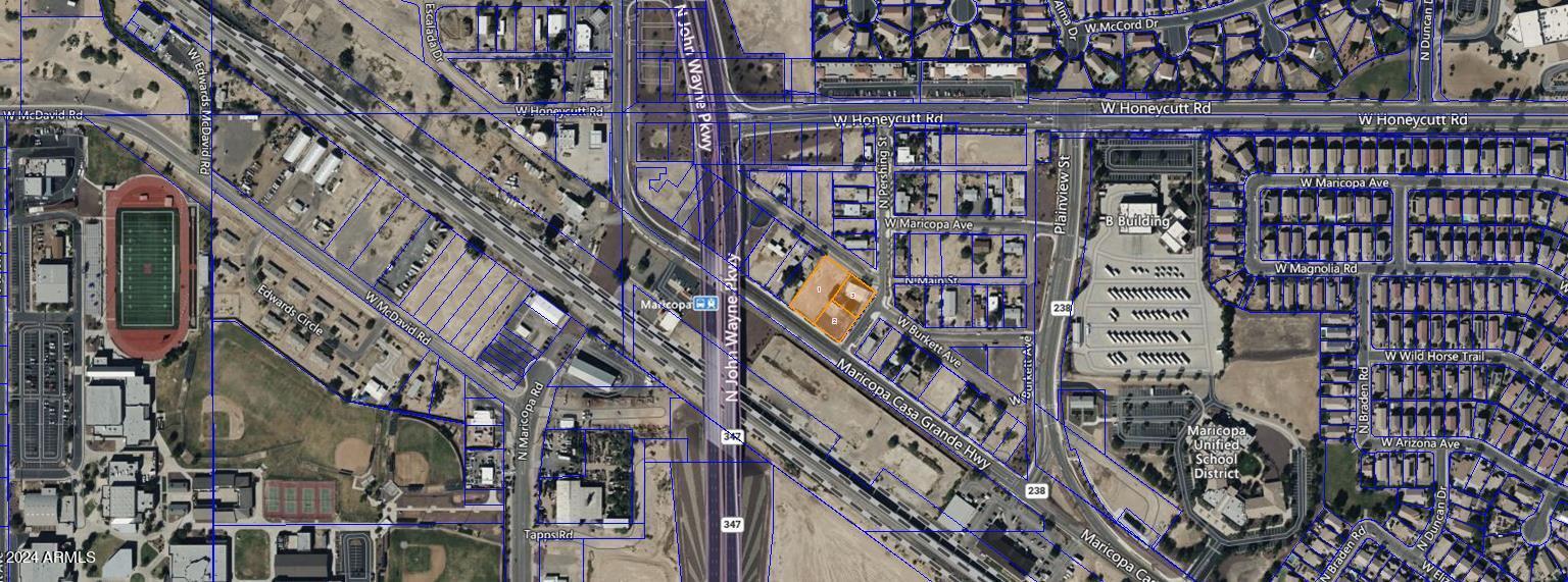 Nearly 1 acre HARD CORNER lot located in the heart of Maricopa.  Great exposure with nearly 200 feet of frontage on Maricopa-Casa Grande Highway.  Property consists of 3 parcels.