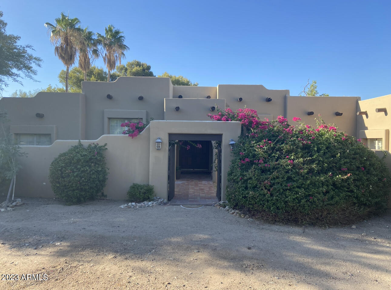 Unbelievable opportunity to buy a custom home in this highly sought after community in Paradise Valley with outstanding views of Mummy Mountain. This home needs work inside and out and can be redone to your custom standards. Large office can be an attached casita with private entrance. There is an additional room attached to the garage that can also be made into an additional bedroom or small casita.