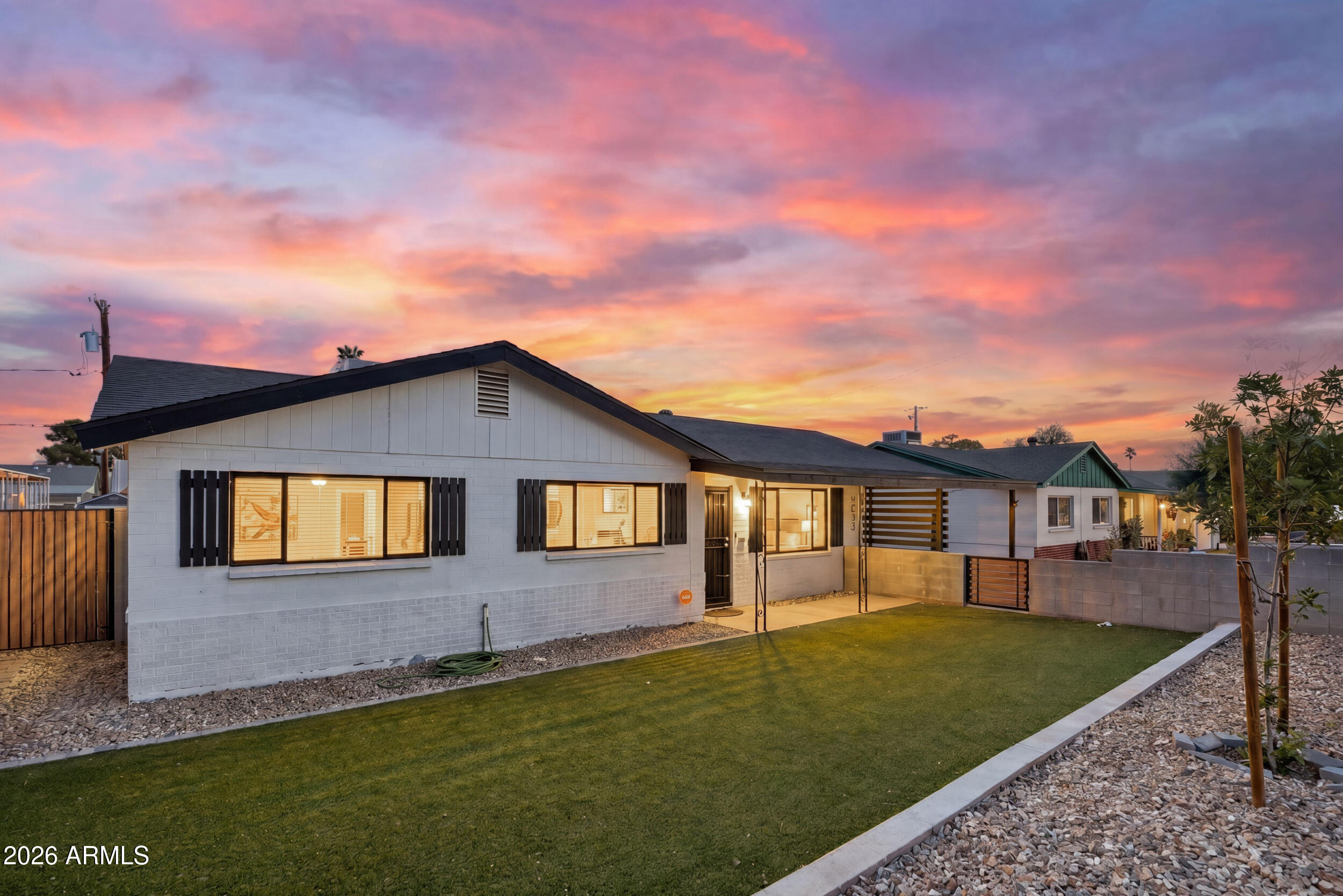 Beautifully remodeled 4-bedroom single-story stunner in the heart of Phoenix! This one checks every box. Tucked in an unbeatable central location just minutes from the 51 and all the uptown shopping, dining and nightlife you could want. Step inside to an immaculate, wall-to-wall remodel designed for entertaining: an open kitchen with stainless steel appliances, crisp white cabinetry, an elegant backsplash and an island with breakfast bar. Rich wood-look flooring flows through the common areas, while plush carpet keeps the bedrooms cozy. Unwind in the sun-soaked Arizona room, then head out back to your showstopper--a brand-new pool built for those perfect Arizona days.