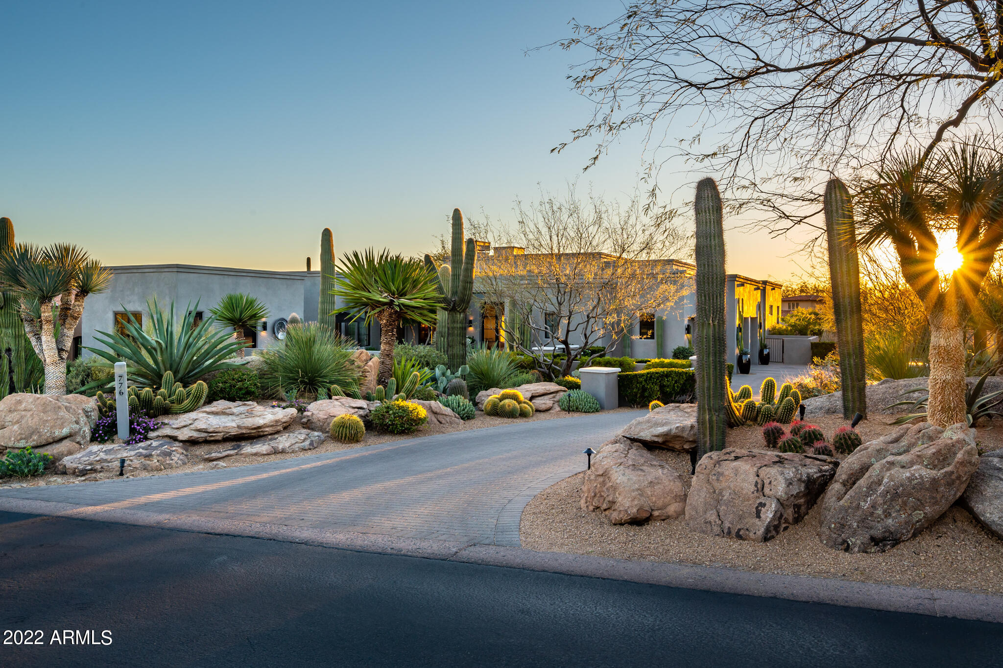 Masterfully modern, this custom home in the highly coveted Desert Highlands community boasts luxury living in an easy casual setting. Uniquely designed interior blends traditional finishes with touches of contemporary elegance. Wide plank European white oak flooring throughout complements the antique white-washed ceiling beams in the great room. Electronic, large pocket doors reveal an exquisite patio with large fireplace for cool evenings, heated pool and spa with water feature, all displayed in the shadow of the iconic Pinnacle Peak Mountain. Custom milled cabinetry and premium stainless steel appliances contribute to the elegantly appointed chefs kitchen in this stunning 4 bedroom 4.5 baths with detached  casita. This move-in ready home in Desert Highlands, ranked as a top 100 club by Platinum Clubs of the World, offers world class amenities include a Jack Nicklaus championship golf course, 18 hole putting course, award winning clubhouse featuring Jack's Gastropub and Jack's Backyard, 2 bocce ball courts, Highlands Racquet Club offering 13 tennis courts  ( 4 grass ), 2 pickelball courts and  a 10,000 sf state of the art fitness center.
