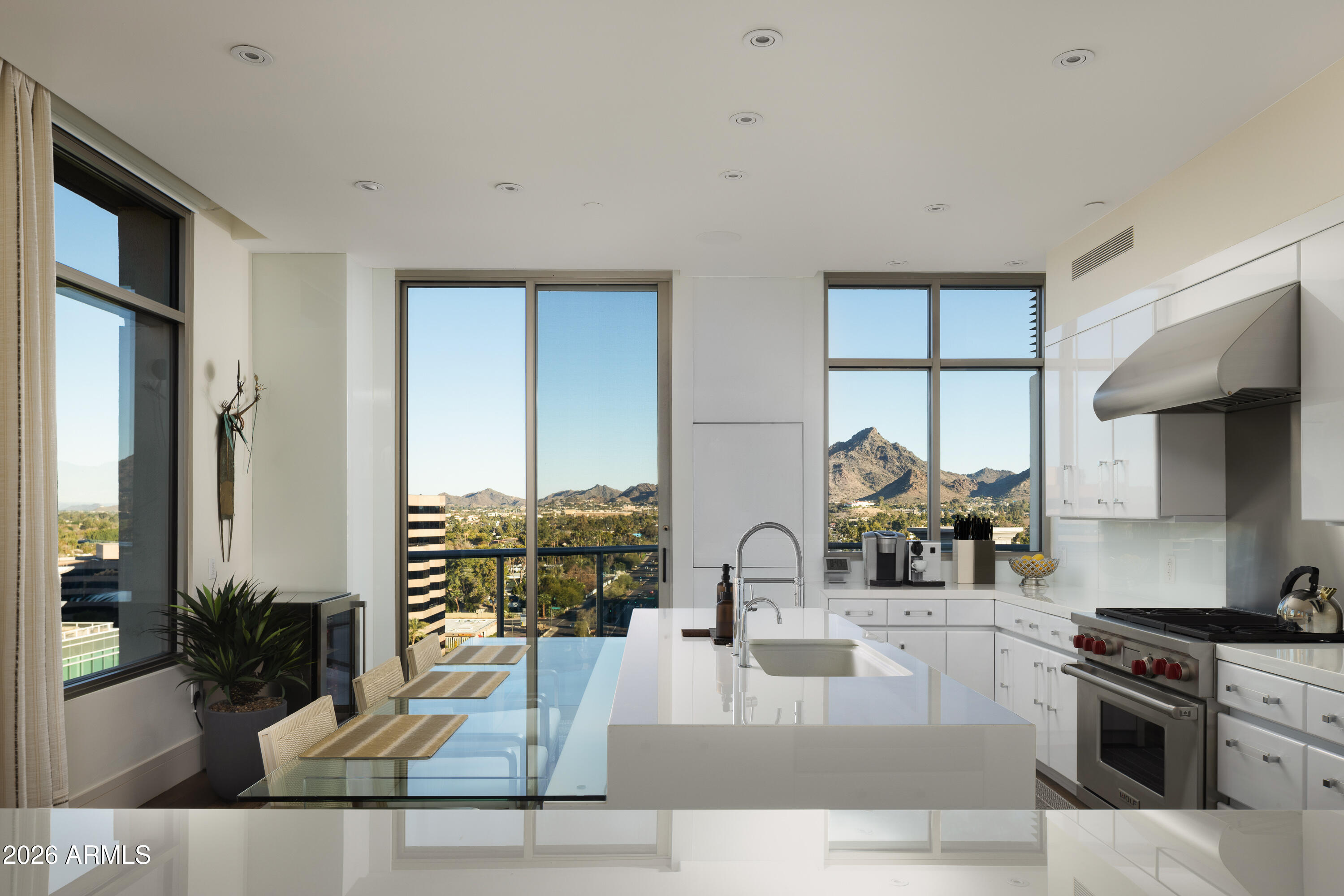 The crown jewel of the ultra luxurious Esplanade Place, Penthouse 1 is the only penthouse unit to capture views of Downtown, Camelback, and Piestewa Peak. Remodeled in 2021, this designer touched masterpiece brings an eloquent, timeless styling of contemporary throughout its spacious 3,350 sq ft floor plan. The chef's kitchen features a gas Wolf cooktop, island, and Sub Zero fridge. Esplanade Place features 24/7 concierge services, valet, workout room, locker rooms with steam saunas, rooftop pool, and more, providing its residents with peak convenience and security.  Walking distance to Biltmore Fashion Park, this penthouse provides easy access to some of Phoenix's best shopping and dining. Just 8 miles from Sky Arbor, living at Esplanade creates easy travelling for its residents.