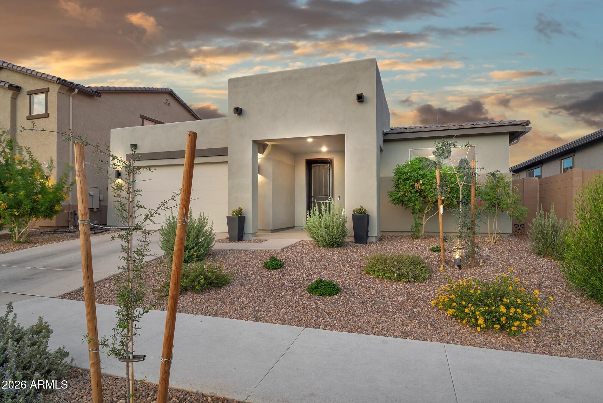 Welcome to this nearly-new home at Empire Pointe, perfectly positioned directly across from a large neighborhood green belt for open space out front instead of a neighbor's rooftop. Inside, almost 2,700 square feet is thoughtfully laid out with 4 bedrooms, 3.5 bathrooms, and a den that could be a home office, playroom, or bonus space. The spacious great room flows seamlessly into a beautifully finished kitchen anchored by a large island, and a dual-slider opens the space to a nicely-landscaped back yard for effortless indoor/outdoor living. Built only about two years ago, this home was done right where it counts, featuring a tankless water heater, a whole home water filtration and softening system, and a third car tandem garage for the storage and flex space many homes don't offer. The community delivers just as much, with a fitness center, sparkling pool and jacuzzi, pickleball and basketball courts, shaded play structures, play lawns, and two dog parks. Newer construction, smart upgrades, and a premium green belt location all come together here.