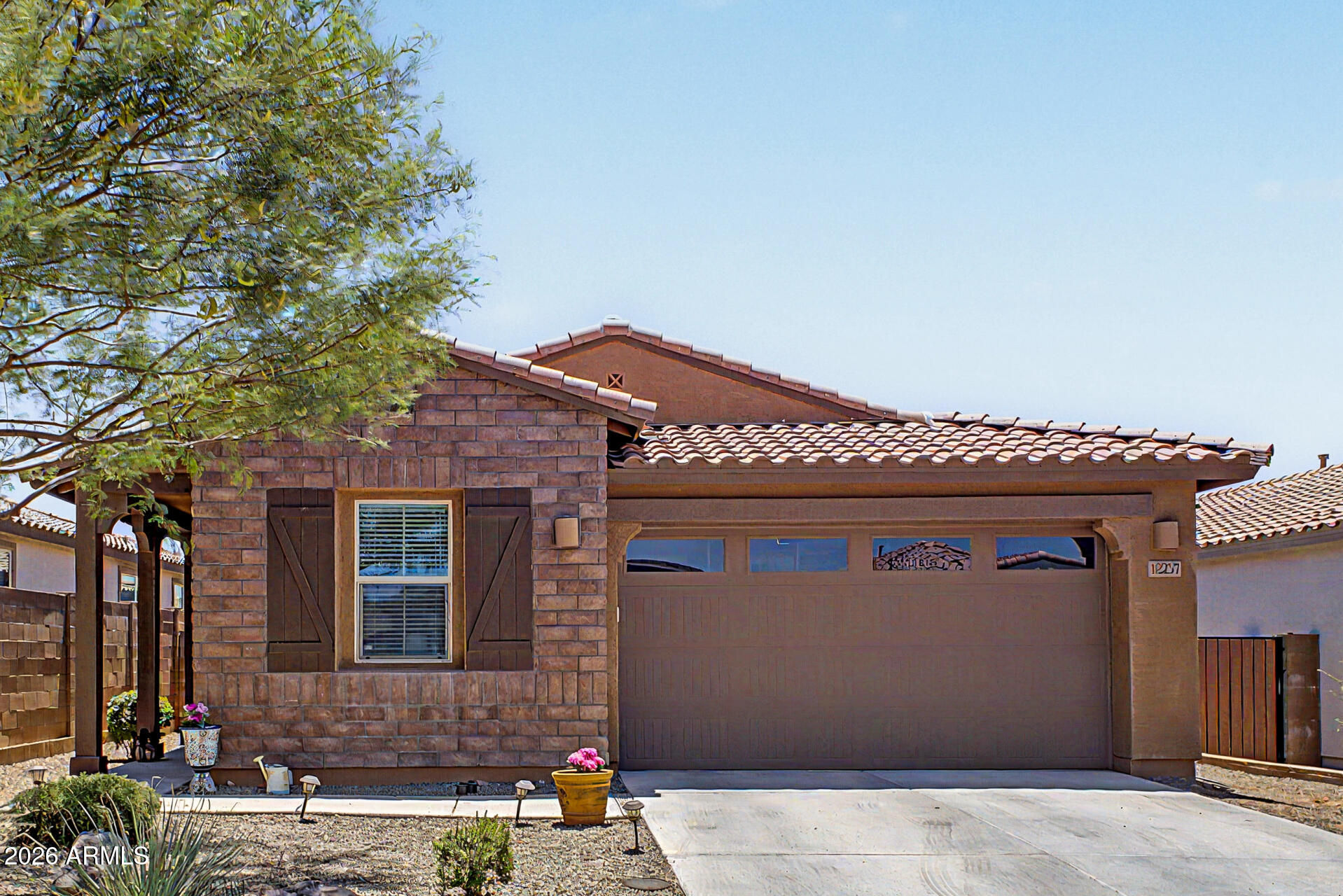 Beautiful single-level home in Peralta Canyon featuring a spacious open-concept floorplan with 4 bedrooms and 2 bathrooms. This popular layout offers a split primary suite, generous great room, and an open kitchen perfect for entertaining. The kitchen showcases stylish countertops, designer backsplash, upgraded cabinetry, stainless steel appliances, and a large island with seating.

Additional features include tile flooring in main living areas, tankless hot water heater, dual pane windows, ceiling fans, and abundant natural light throughout. The exterior offers attractive curb appeal with stone accents and a welcoming front elevation.

The private primary suite features a walk-in closet and oversized bathroom with dual sinks and walk-in shower. Enjoy all that Peralta Canyon has to offer including walking paths, parks, and stunning Superstition Mountain views.