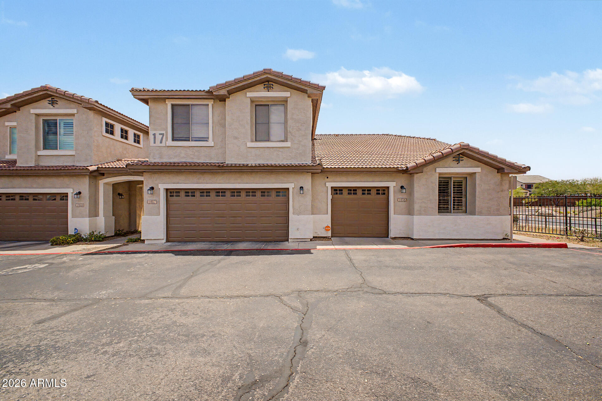 Breathtaking western mountain views and vibrant sunsets await in this stunning end-unit condo nestled in the Ahwatukee foothills. This updated home features a first-floor primary suite, high-end granite in the kitchen and all three baths, and stylish rustic plank flooring.

The open floor plan shines with vaulted ceilings, fresh neutral paint, and elegant plantation shutters. Upstairs, a second bedroom suite offers a private bath and walk-in closet. Enjoy the convenience of an attached garage and the security of a gated community featuring a heated pool, spa, and clubhouse.

Perfectly positioned between two golf courses with easy access to hiking trails and parks, this turnkey property is built to impress.