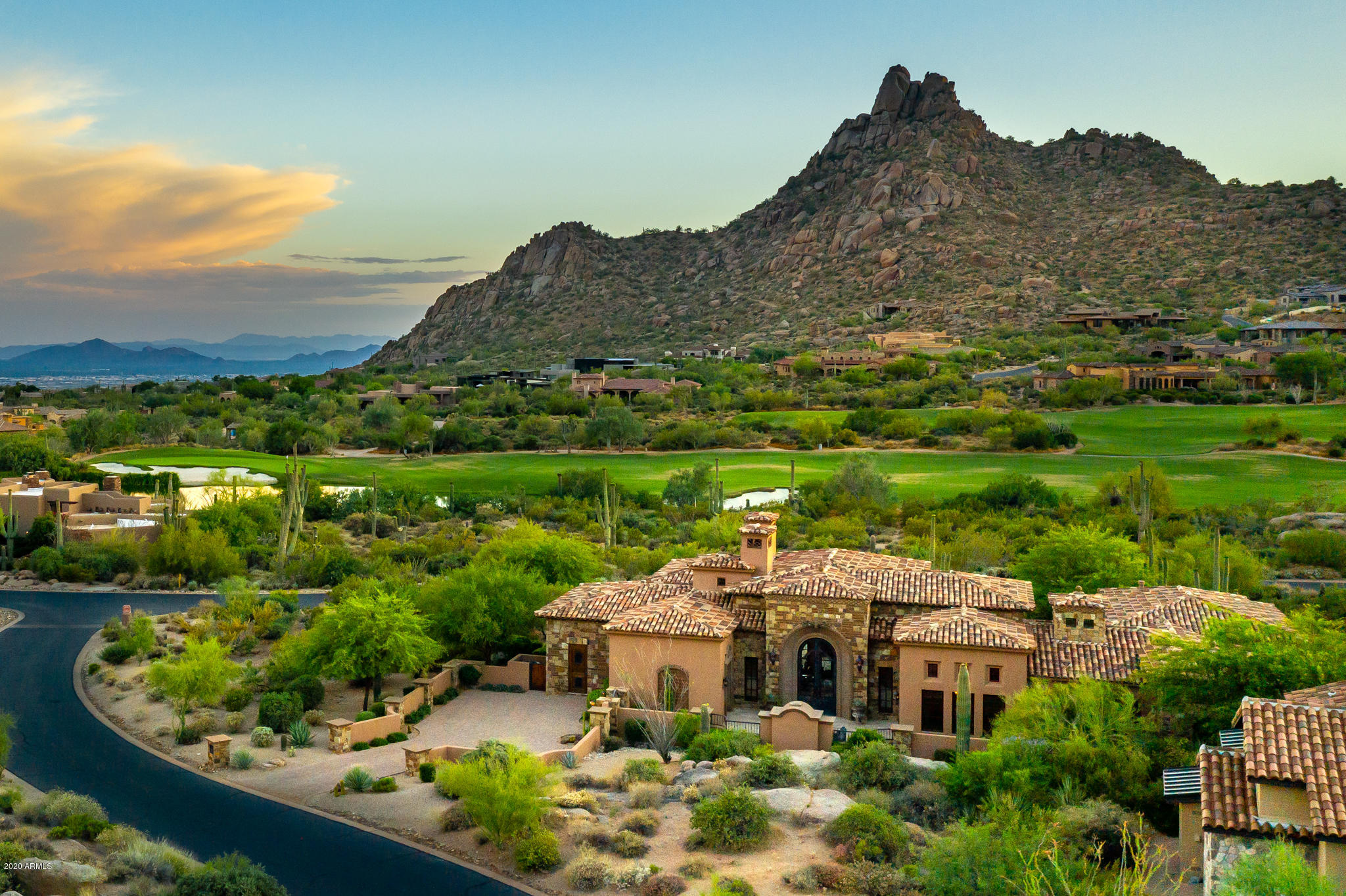 Beautiful true Tuscan inspired custom home w/ panoramic views of Pinnacle Peak located in Estancia Country Club, the number one golf course in AZ per Golf Digest. Lovely, inviting front courtyard entrance w/ fireplace to welcome guests. Soft contemporary interior design throughout lends itself to elegant yet relaxed lifestyle. Open great room looking out to gorgeous mountain views. Gourmet kitchen with top of line appliances opens to great room boasting a dramatic oversized fireplace. Property has a designer level finish throughout. Master Suite w/ romantic fireplace & private patio w/ spa looking out at mountain views. In the backyard generous outdoor covered living space with a TV & fireplace. Heated lap pool, outdoor dining area w/ fireplace, & built in BBQ. ALL furnishings to convey w (w/ exception of afew personal items) convey w/ sale of property. ALL home automation components and TV to also convey with sale. This lovely property is turn key move in ready!