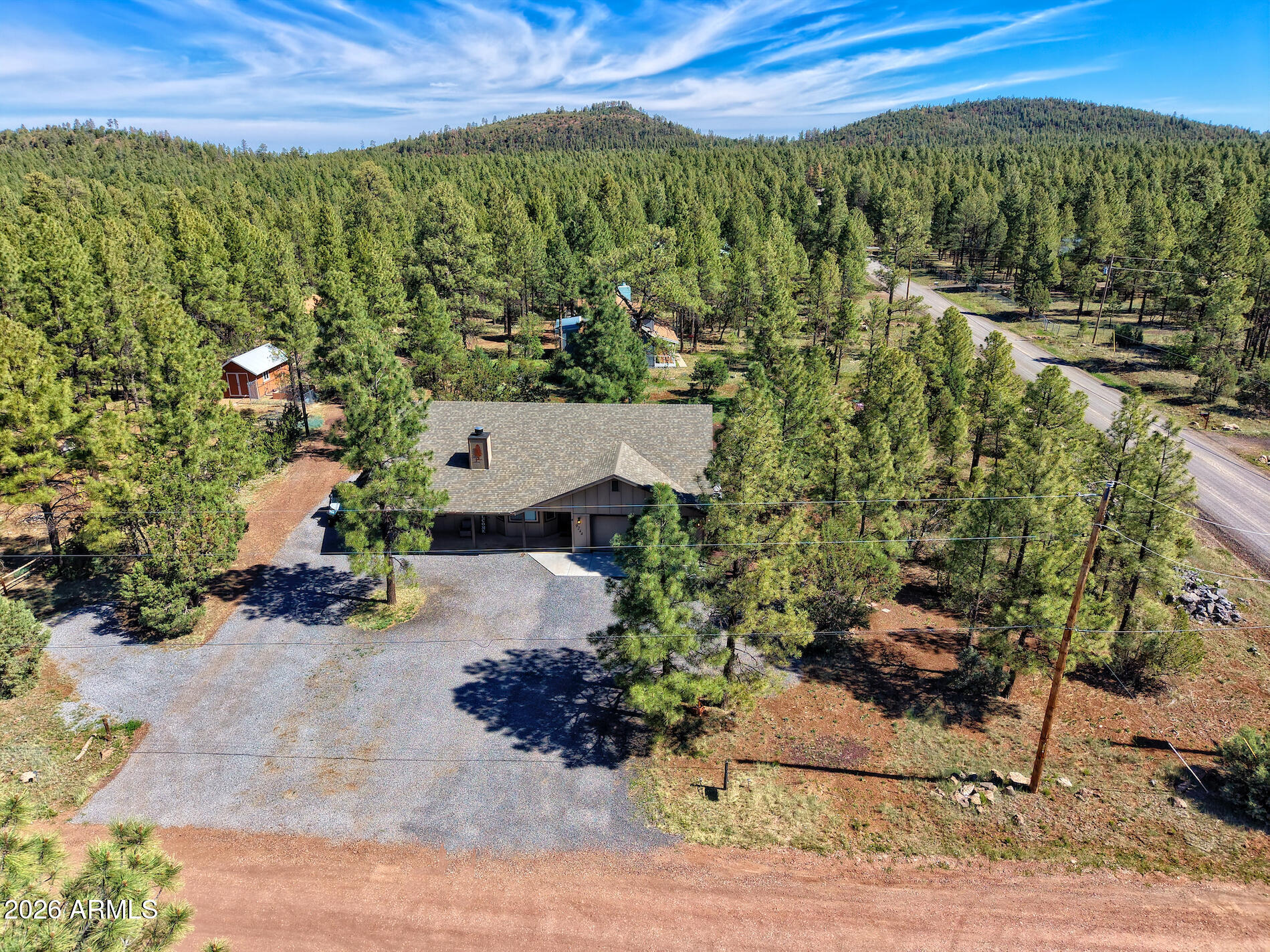 Escape the heat and find your sanctuary in the heart of the White Mountains. Nestled in the towering Ponderosa pines of Lakeside, this exquisite 2023 built retreat offers the rare combination of modern luxury and rugged alpine beauty. Situated just outside the hustle of town, this home is a front-row seat to Arizona's high-country lifestyle. Inside, the modern open-concept design features a cozy fireplace, quartz countertops and a thoughtful split floor plan, perfect for hosting weekend guests or enjoying quiet mountain mornings. With full RV hookups already in place, you're ready to host fellow travelers or park the toys after a day on the trails. Whether you're an avid golfer, a weekend angler, or an accomplished snow skier, you are sure to fall in love with the good life at 7000 feet!!