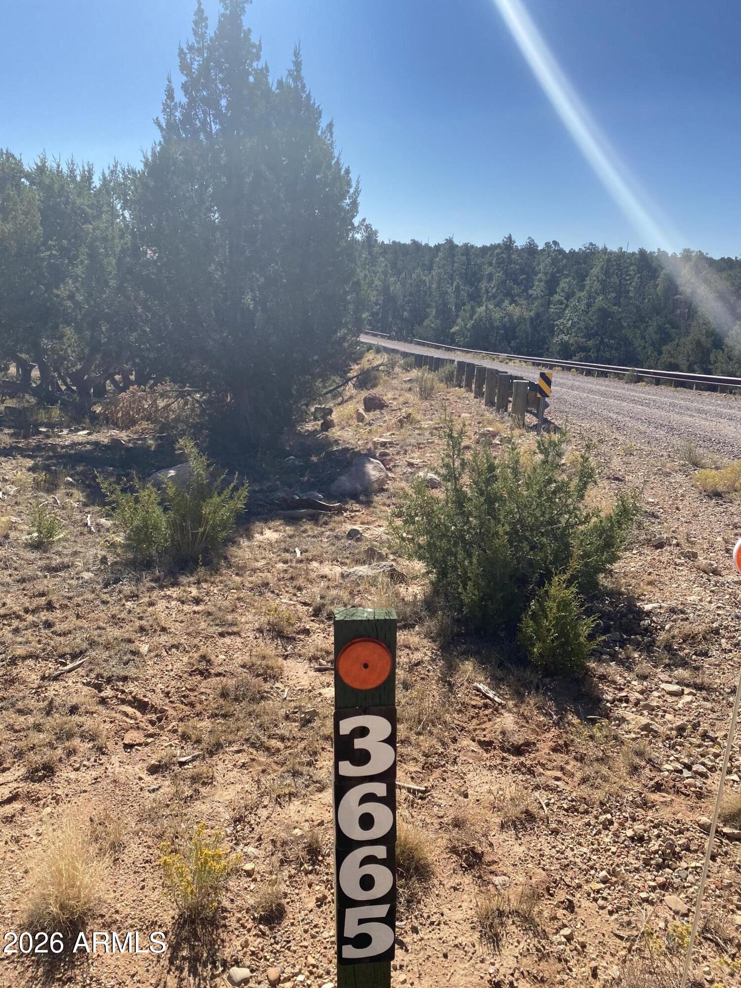 Prime 5-Acre Retreat in the Heart of Happy Jack's Ponderosa Paradise. Escape to your own slice of high-elevation serenity on this expansive 5 acre vacant parcel in the desirable Mogollon Ranch community of Happy Jack, Arizona. Nestled at approximately 7,000-7,500 feet in the majestic Coconino National Forest region along the Mogollon Rim, this wooded gem offers the perfect canvas for your dream mountain cabin, custom site-built home, or family getaway, Corners are marked, utilities are close and a co-op well system--making development straightforward. Deed restrictions ensure quality in the neighborhood (site-built homes only, minimum square footage requirements, no modulars or mobiles) horses are welcome for that true rural Arizona feel.