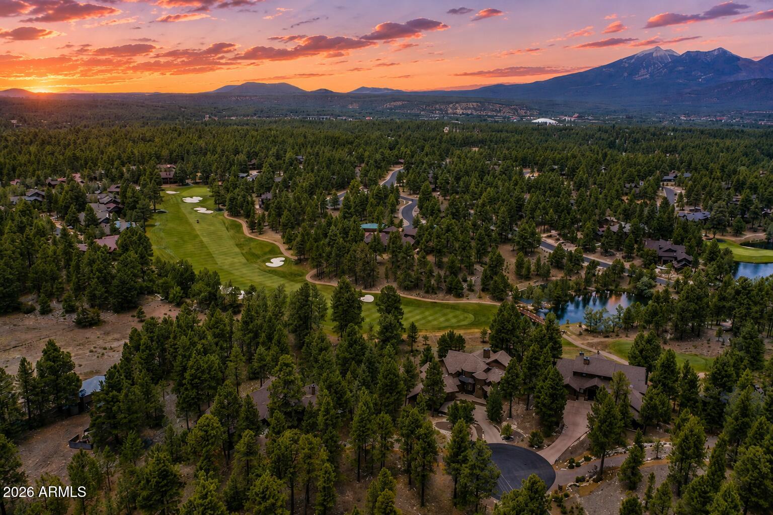PINE CANYON | 1/2-ACRE CUL-DE-SAC LOT | TALL PINES | NEAR THE CLUBHOUSE

A rare opportunity to own approximately half an acre in Pine Canyon, one of Flagstaff's most sought-after private golf communities. Surrounded by towering pine trees, this residential cul-de-sac lot offers city water, sewer, and a prime setting close to the clubhouse. Build a custom mountain retreat or secure a piece of land with long-term investment potential in one of Northern Arizona's premier communities. Pine Canyon offers access to golf, pickleball, fitness facilities, a community pool, clubhouse amenities, and more. Located near Clubhouse Circle with convenient access to the heart of the community. Opportunities to own vacant land in Pine Canyon are limited, making this a property worth seeing in person.