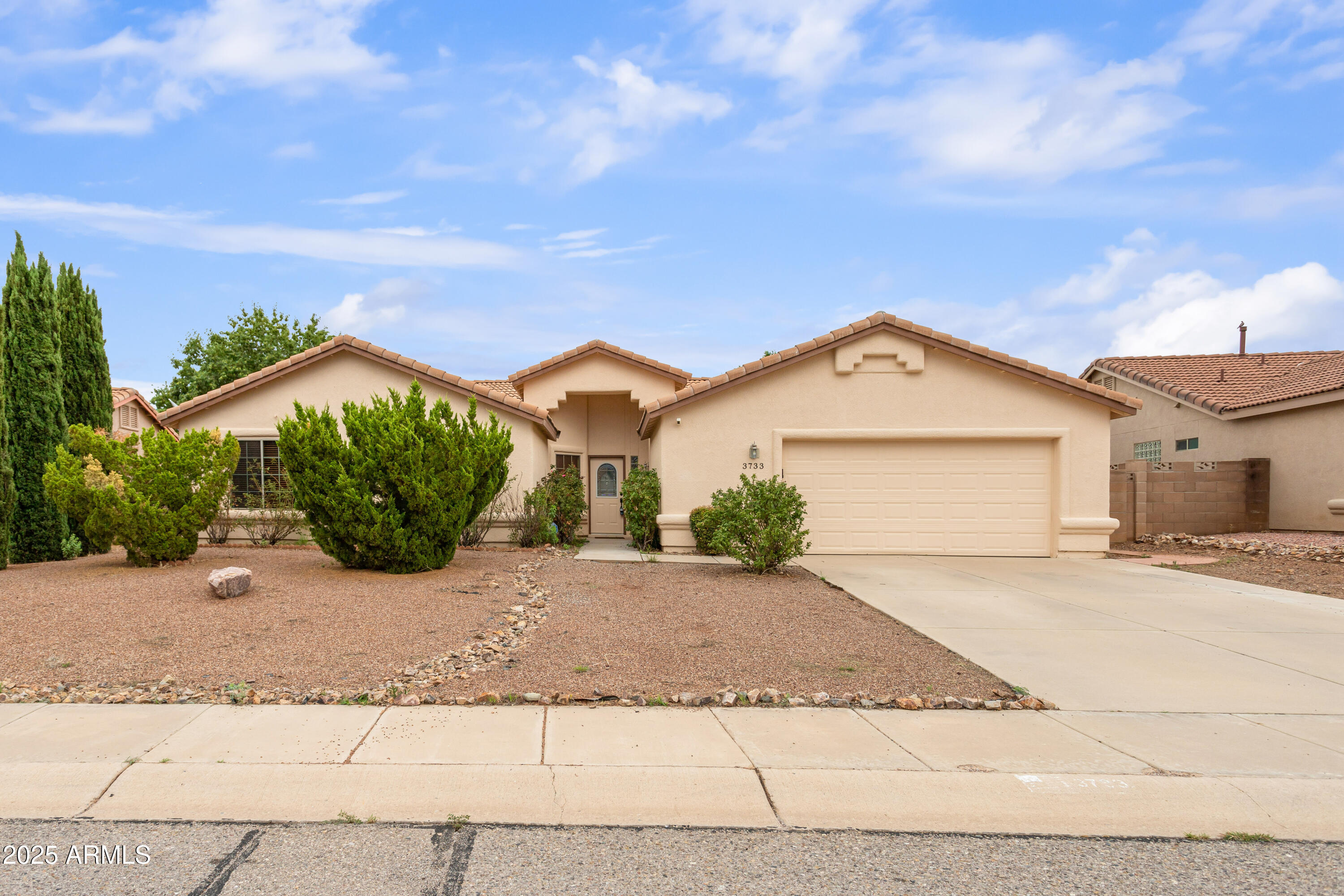 This fantastic 4 bedroom and 2.5 bathroom house located in the highly desired subdivision of Canyon De Flores is ready to be called HOME. Interior has space for your needs with 2 living spaces and a large open kitchen equipped with an island and stainless appliances. Half bathroom is located centrally to living spaces and kitchen making this ideal for entertaining and gatherings. Fireplace in main living room. Primary bedroom has ensuite that allows for you to escape in the soaker tub, shower stall is separate and there are 2 sink vanity. Outside space is not limited on this property with a covered patio and different areas to help you enjoy your backyard