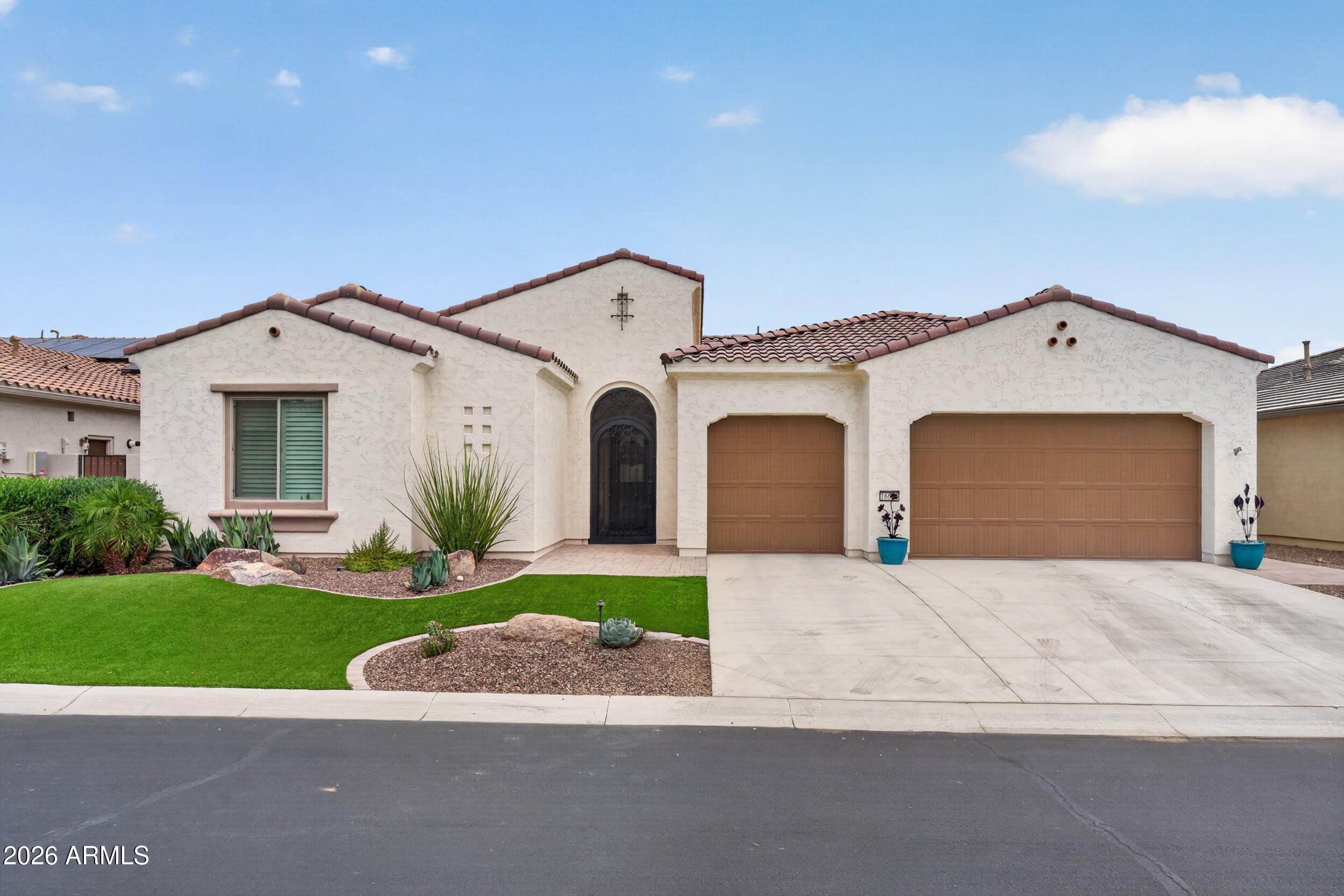 Located on one of the most picturesque streets in the award-winning PebbleCreek active adult resort community, this highly sought-after Solstice model delivers luxury living with no wait to build. Completed in 2022, this exceptional home showcases soaring ceilings, expansive open-concept living, spacious bedrooms, a versatile den, and designer upgrades throughout, including Hunter Douglas PowerView automated shades and dramatic floor-to-ceiling pocket doors that create seamless indoor/outdoor living.

At the heart of the home, the chef-inspired kitchen impresses with rich cabinetry, quartz countertops, oversized island with breakfast bar, gas cooktop, stainless steel appliances, beverage refrigerator, butler's pantry, and an expansive walk-in pantry. Flexible den and bonus spaces provide ideal options for a home office, media room, hobby space, or private retreat, while the formal dining area is surrounded by windows overlooking the spectacular backyard oasis.

Designed for both entertaining and relaxation, the resort-style backyard features a sparkling pool with modern technology and multiple water features, custom landscape lighting, built-in barbecue, artificial turf, citrus trees, view fencing, and an expansive covered patio with canned lighting and generous space for outdoor dining and lounging beneath Arizona's breathtaking sunsets.

Adding exceptional value, the home includes solar for enhanced energy efficiency, potential utility savings, and year-round comfort during Arizona's warm summers. A spacious 3-car garage offers abundant room for vehicles, golf carts, storage, and recreational gear.

Enjoy the unmatched lifestyle of PebbleCreek with championship golf, pickleball, tennis, bocce, resort-style pools, state-of-the-art fitness centers, creative arts studios, performing arts theater, restaurants, clubs, and endless social activities. After a day enjoying the community's world-class amenities, retreat to the elegant primary suite and welcoming guest accommodations designed for comfort and privacy.

Additional upgrades include high-end window coverings, custom ornate security screen door, and an Earthsmarte water treatment system. This exceptional residence combines modern luxury, thoughtful design, energy-conscious living, and the vibrant lifestyle of one of Arizona's premier guard-gated 55+ communities.