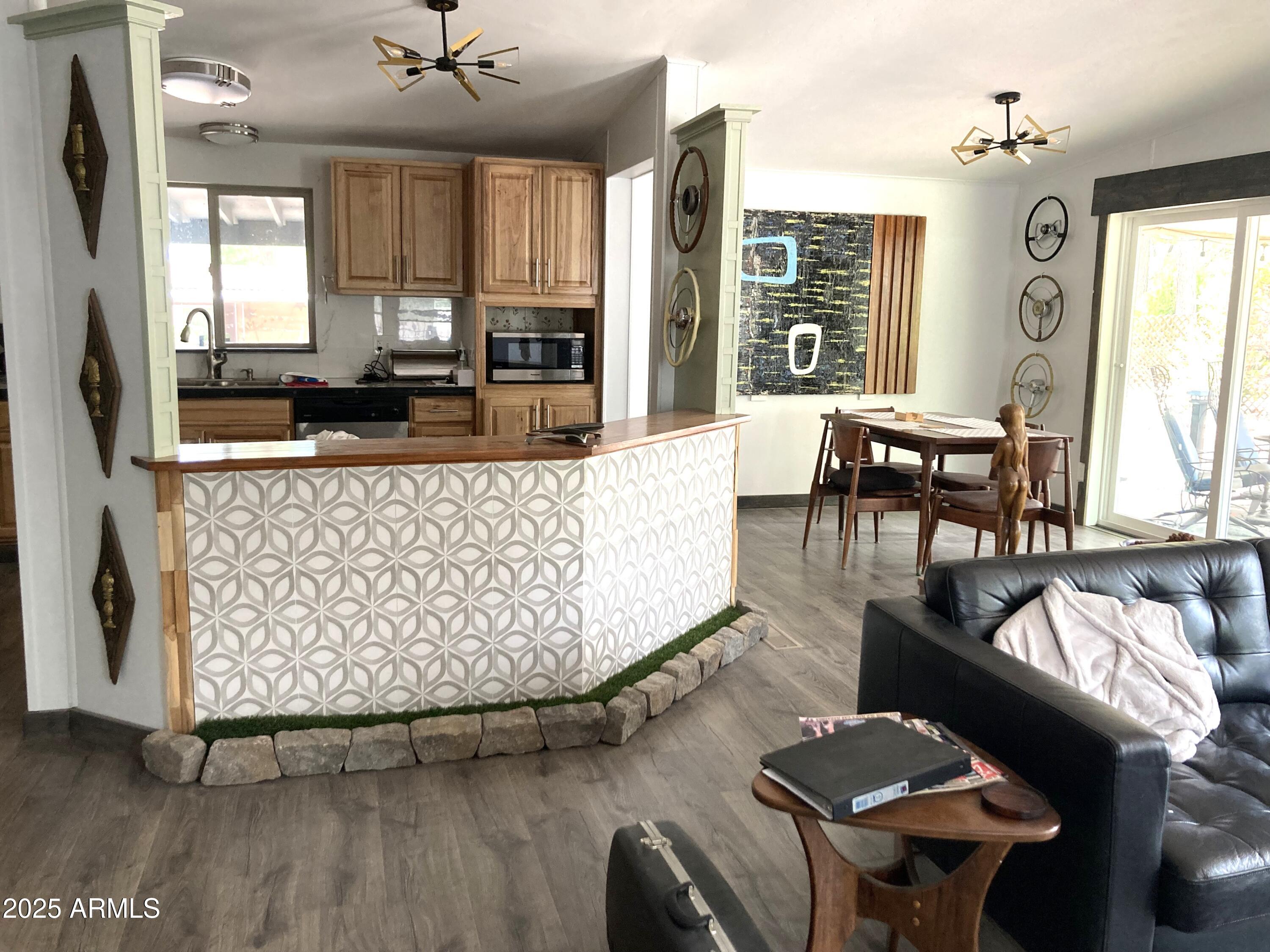 Mid Century Modern slash cabin in the woods. in Payson AZ. Roof shingles on house redone 3 years ago. House was re-plumbed with PEX about 4 years ago. Kitchen and bathrooms have been upgraded aswell as flooring , int. doors and fixtures. Detached garage and a huge treed lot - Gym room or possible 4th bedroom, salon, art studio, music room whatever.  You'll want to see this one.