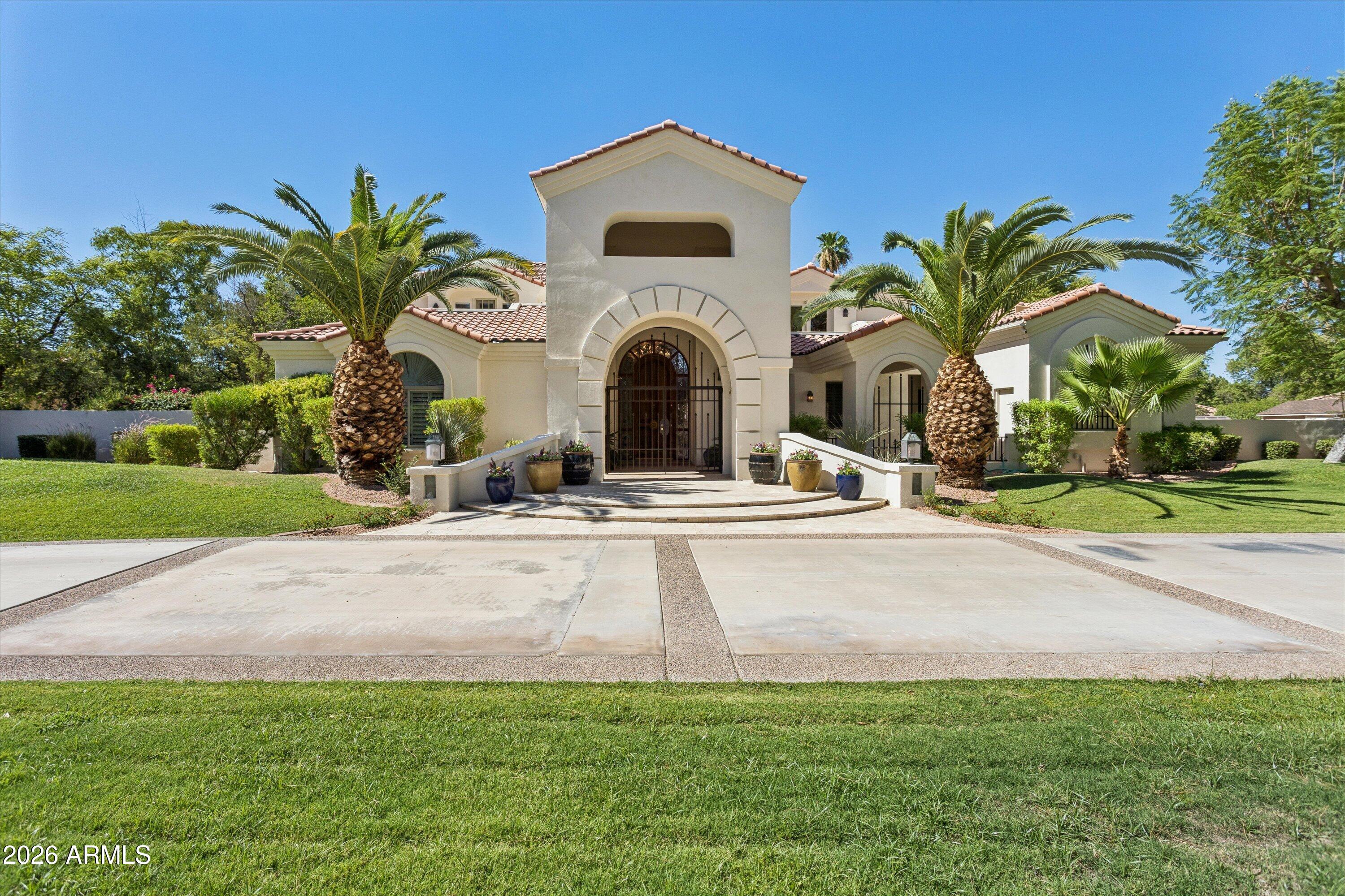 DISCOVER TIMELESS ELEGANCE IN THIS CUSTOM HOME NESTLED ON OVER AN ACRE IN ONE OF PARADISE VALLEY'S MOST COVETED LOCATIONS. OFFERING APPROX. 6,000 SQ. FT. OF BEAUTIFULLY DESIGNED LIVING SPACE. THIS STUNNING TWO-STORY RESIDENCE WITH A FINISHED BASEMENT BLENDS SOPHISTICATED DESIGN WITH EXCEPTIONAL AMENITIES FOR EFFORTLESS LUXURY LIVING.
FOUR BEDROOM SUITES, EACH WITH THEIR OWN ENSUITE BATH WHICH PROVIDES A LEVEL OF COMFORT AND PRIVACY, WHILE TWO ADDITIONAL BATHS ARE CONVENIENTLY POSITIONED TO ACCOMMODATE GUESTS AND EVERYDAY LIVING.
AT THE HEART OF THE HOME, THE DRAMATIC GREAT ROOM SHOWCASES SOARING TWO-STORY CEILINGS, FIREPLACE AND A CUSTOM WET BAR, CREATING AN UNFORGETTABLE SPACE FOR BOTH QUIET EVENINGS AND GRAND ENTERTAINING.
*see supplement for more* DESIGNED FOR TODAY'S FLEXIBLE LIFESTYLE. THE HOME ALSO FEATURES TWO PRIVATE OFFICES, EACH ENHANCED WITH CUSTOM 
CABINTRY, ALONG WITH A SPACIOUS 2ND FLOOR LOFT THAT OFFERS ENDLESS POSSIBILITIES LIKE A READING LOUNGE, MEDIA SPACE OR ADDITIONAL FAMILY RETREAT.
THE FINISHED BASEMENT FEATURES A SPACIOUS TV ROOM AND ACTIVITY ROOM WITH CUSTOM BUILT-INS AND A PRIVATE SHOOTING RANGE. THIS HOME IS READY FOR YOU TO ADD YOUR OWN TOUCHES.
STEP OUT TO YOUR OWN PRIVATE RESORT WHERE LOVELY LANDSCAPED GROUNDS INVITE BOTH RELAXATION AND CELEBRATION. ENJOY A SPARKLING POOL ACCENTED BY A TRANQUIL FOUNTAIN, A SECLUDED FIREPLACE RETREAT PERFECT FOR QUIET EVENINGS UNDER THE ARIZONA SKY AND A CHARMING GAZEBO COMPLETE WITH A BUILT-IN BBQ OVERLOOKING THE EXPANSIVE POOLSIDE ENTERTAINING AREA.
A LUSH GRASS PLAY AREA COMPLETES THIS OUTDOOR PARADISE.
PERFECTLY POSITIONED NEAR MOCKINGBIRD LANE AND INVERGORDON ROAD THIS PV ESTATE OFFERS THE IDEAL BALANCE OF PRIVACY AND CONVENIENCE. JUST MINUTES FROM WORLD-CLASS GOLF, FINE DINING, UPSCALE SHOPPING, PREMIER RESORTS AND ALL THAT PARADISE VALLEY AND SCOTTSDALE CAN OFFER.