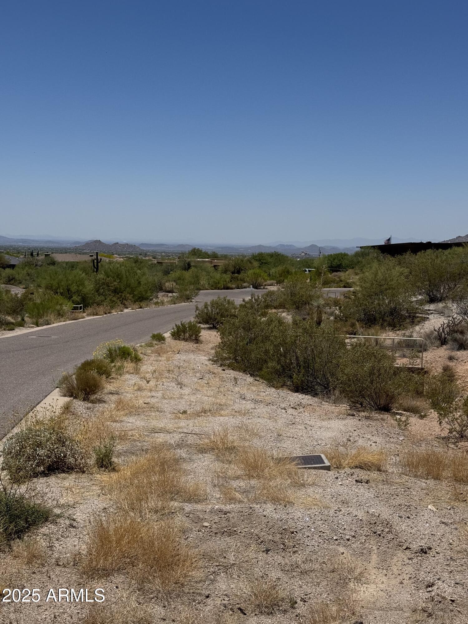 Stunning Vacant View Lot in North Scottsdale! Discover the perfect opportunity to build your dream home on this exceptional nearly 1-acre view lot. This prime parcel offers breathtaking panoramic views of Scottsdale's city lights and majestic desert landscapes, both day and night. Ready for development, the lot comes fully equipped with on-site utilities, including water, sewer, gas, & electricity. The lot has no HOA but does have CCR's to protect value. The lot comes with fully developed 4,065 sq/ft house plans ready for submission to the city for permitting. This is a fantastic opportunity to build your dream home with plans already designed, saving you time and effort in the development process.