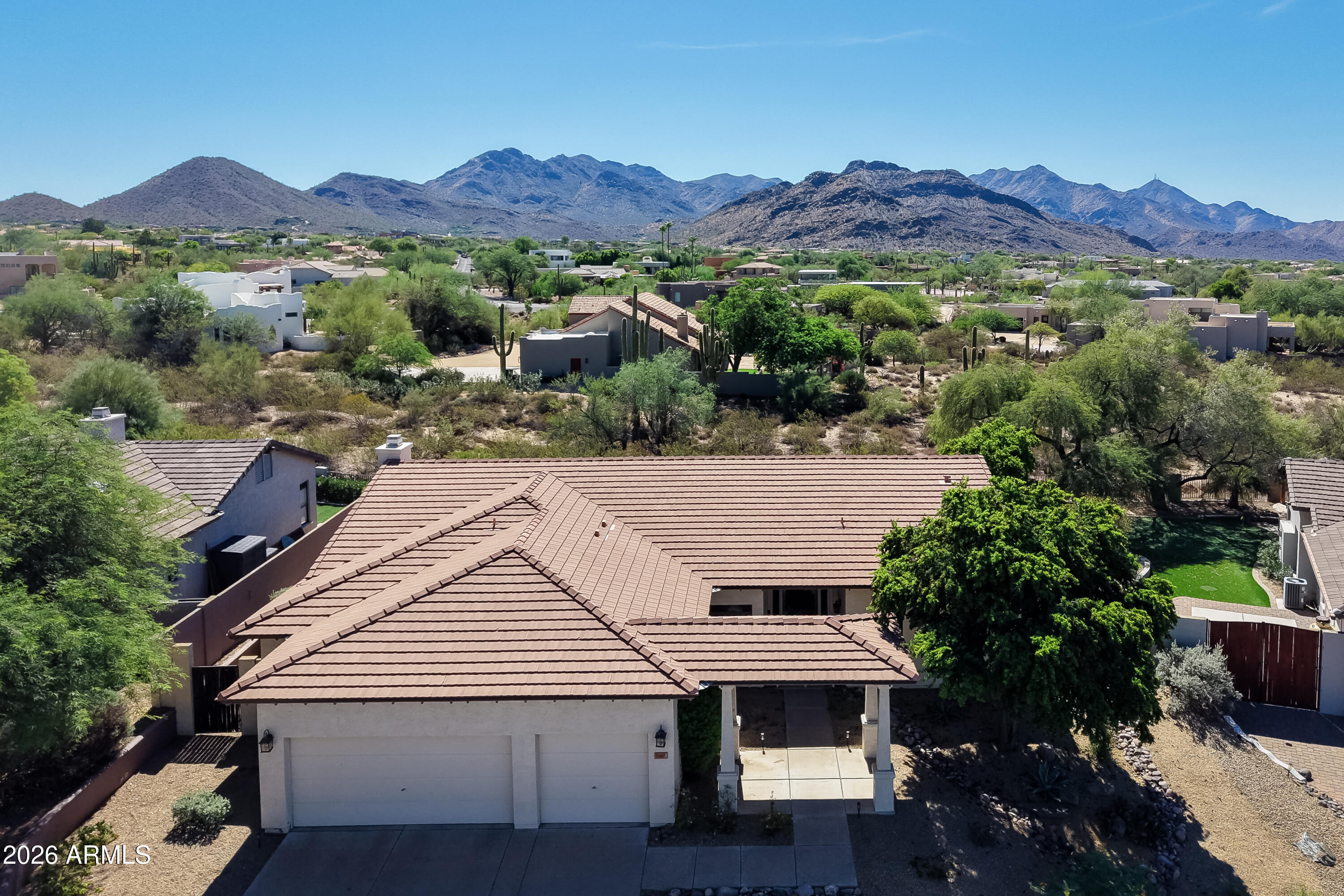 Reach out and touch the Sonoran Desert as you take in the breathtaking mountain expanse from this beautiful Shea Home in Pinnacle Peak Vistas. This is why people move to the Valley of the Sun. Featuring 2 bedrooms plus a den, 2 baths, 2300+ sq ft, tile roof, fireplace, gourmet kitchen, dual A/Cs, water softener, new ceiling fans (2026), new carpet (2026) , new interior paint (2026), new water heater (2025), heated pool & spa (underground propane tank), and so much more! Roof underlayment replaced approx 12 years ago (tile spot replaced as needed). Ideal for seasonal visitors & year round residents alike. Take advantage of all the readily accessible hiking options of Pinnacle Peak while being a hop, skip & a jump from the Loop 101 freeway and wherever you need to go. Hurry to this one. One A/C unit is approx 5 years old, the other is approx 15 years old. Serviced regularly.

Property line extends beyond back fence, but is NAOS restricted from development. Enjoy the undisturbed natural desert just beyond your wall. Buyer to investigate use restrictions, property boundaries, etc during due diligence period. General NAOS information can be found on the City of Scottsdale's website.