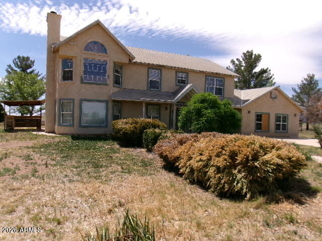 This is a huge home is a diamond in the rough. There are 6 bedrooms, 2.5 baths, HUGE family room, living and dining room. There is a private well as well as several animal pens. You will love the mature trees as well as the great view and paved road access.