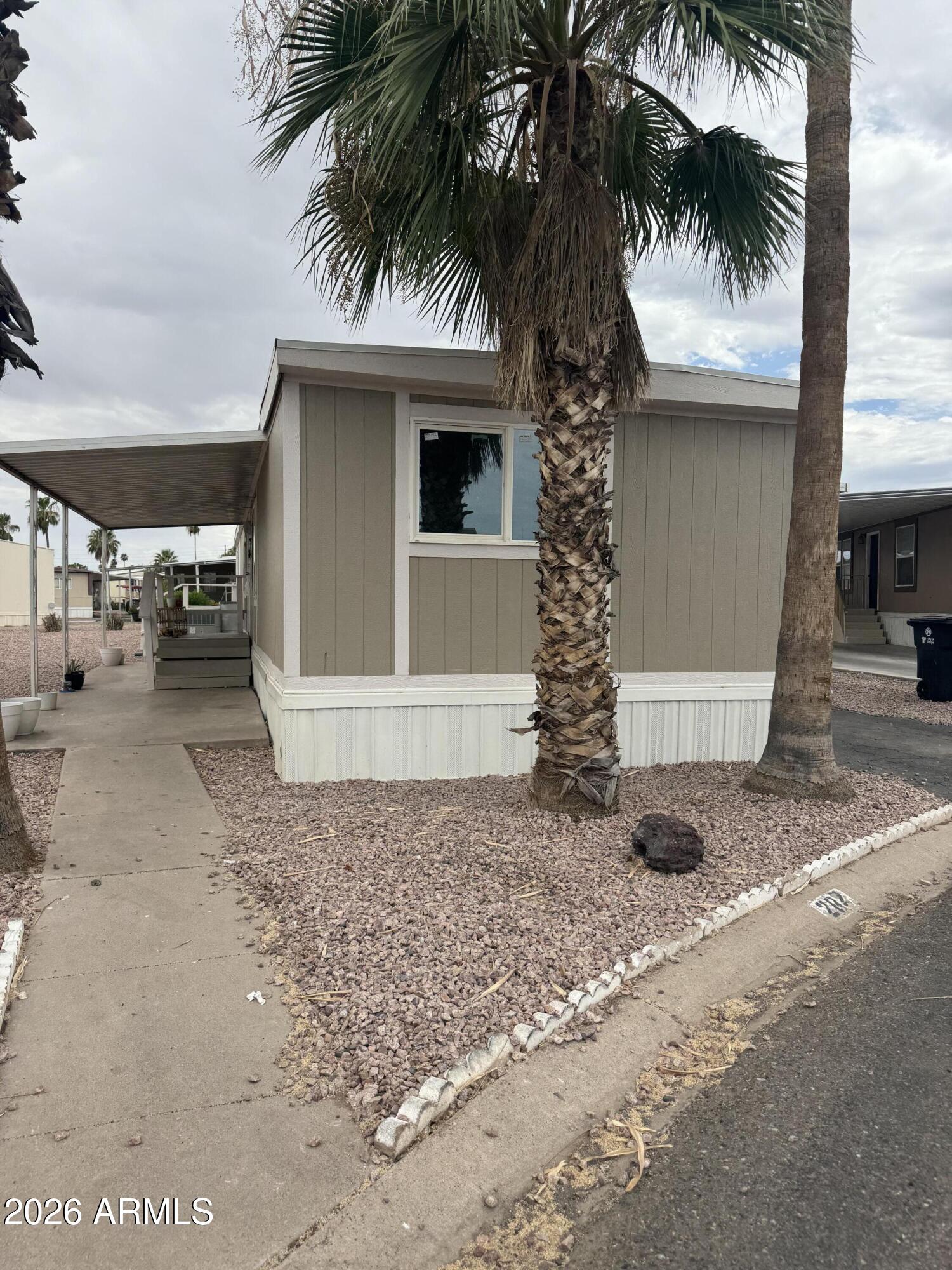 Discover this beautiful manufactured home located in the ALL-AGE community of Chaparral Village. Perfectly situated on a cul-de-sac, this home features 3 bedrooms and 2 bathrooms, making it ideal for families or those seeking extra space. Inside, you'll find modern amenities including laminate flooring, elegant granite countertops, central AC, and modern appliances, all designed for comfort and convenience. Chaparral Village offers great amenities, including a swimming pool, clubhouse, playground, volleyball and basketball courts, billiard room, and off-street parking--perfect for fun and relaxation