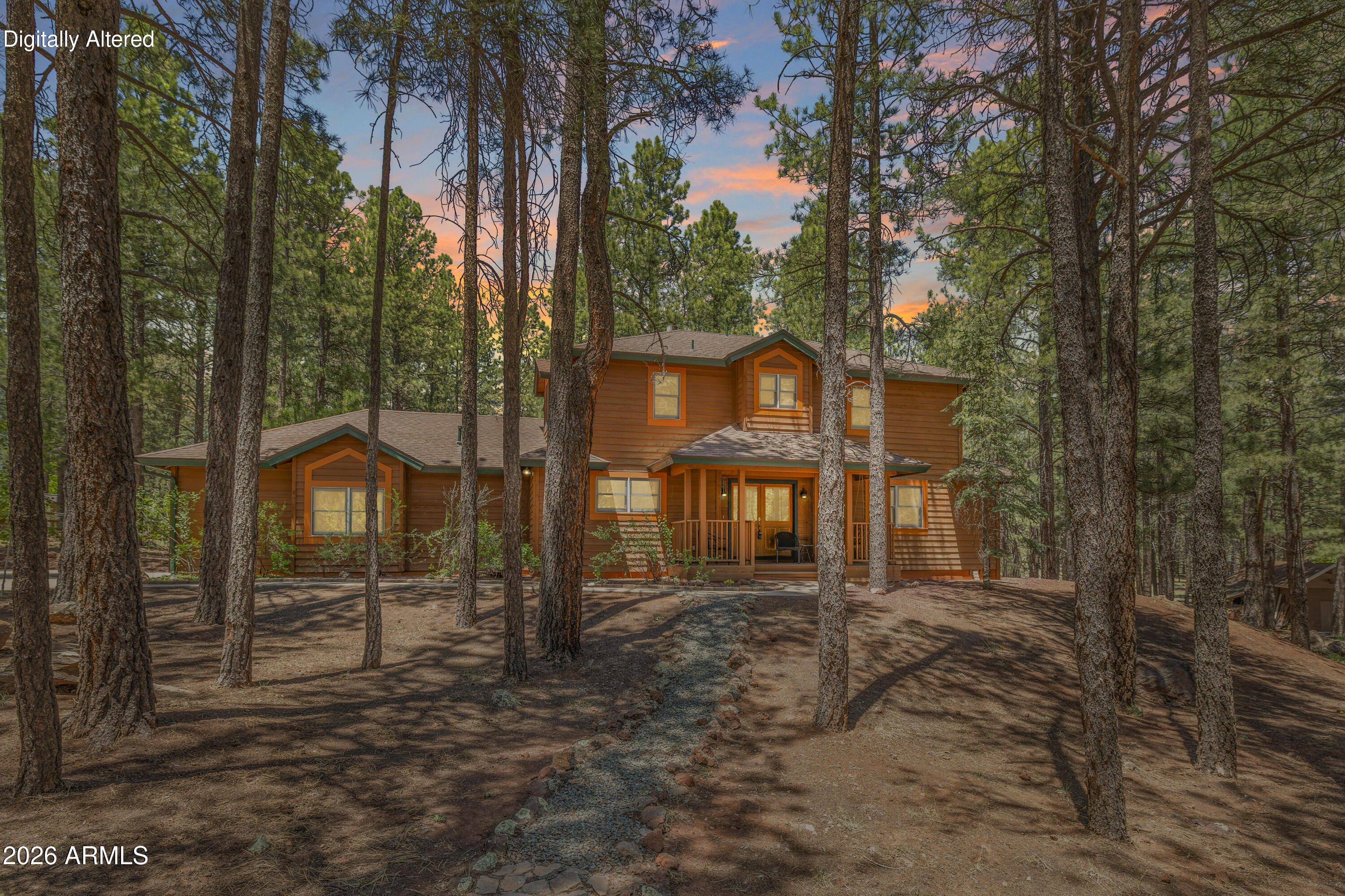 A rare opportunity to own a custom home in Flagstaff's gorgeous Equestrian Estates. Set on more than an acre beneath towering ponderosa pines and backing open space, this 4-bedroom, 3.5-bath property offers full horse facilities and privileges. The main home features a dramatic great room with soaring vaulted ceilings, fireplace, and a wall of windows framing the forested backyard. A spacious kitchen includes abundant counter space, all appliances and a large island with breakfast bar. Upstairs offers a loft, two oversized guest bedrooms and a Jack-and-Jill bath. An attached casita with private entry, living area, and en-suite bath adds flexibility for guests or multigenerational living. Enjoy the expansive rear deck, horse barn, play yard, and true mountain living with city conveniences.